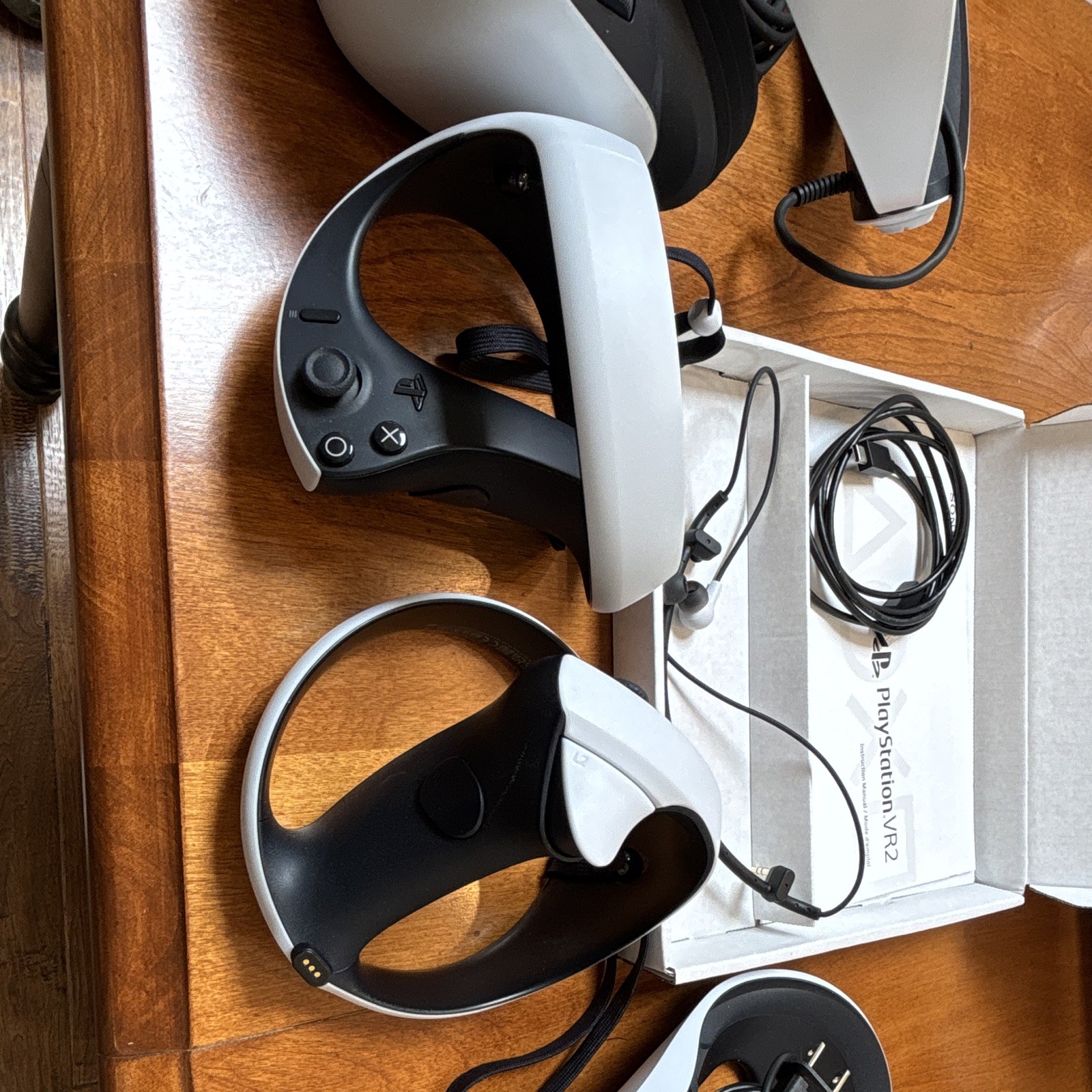 Sony playstation vr2 with controllers, charging dock, no game.