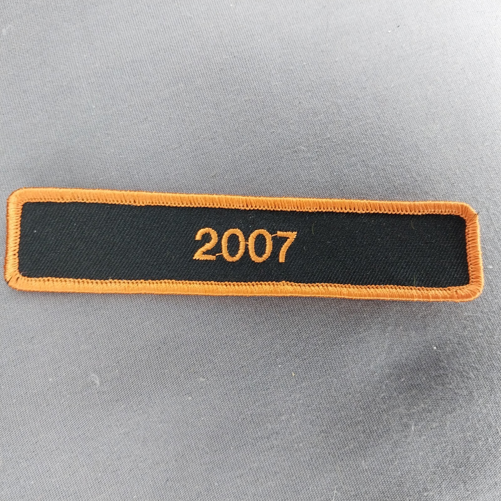 2007 Harley Colors Black Orange 4 3/4"x1" Iron On Tab Patch