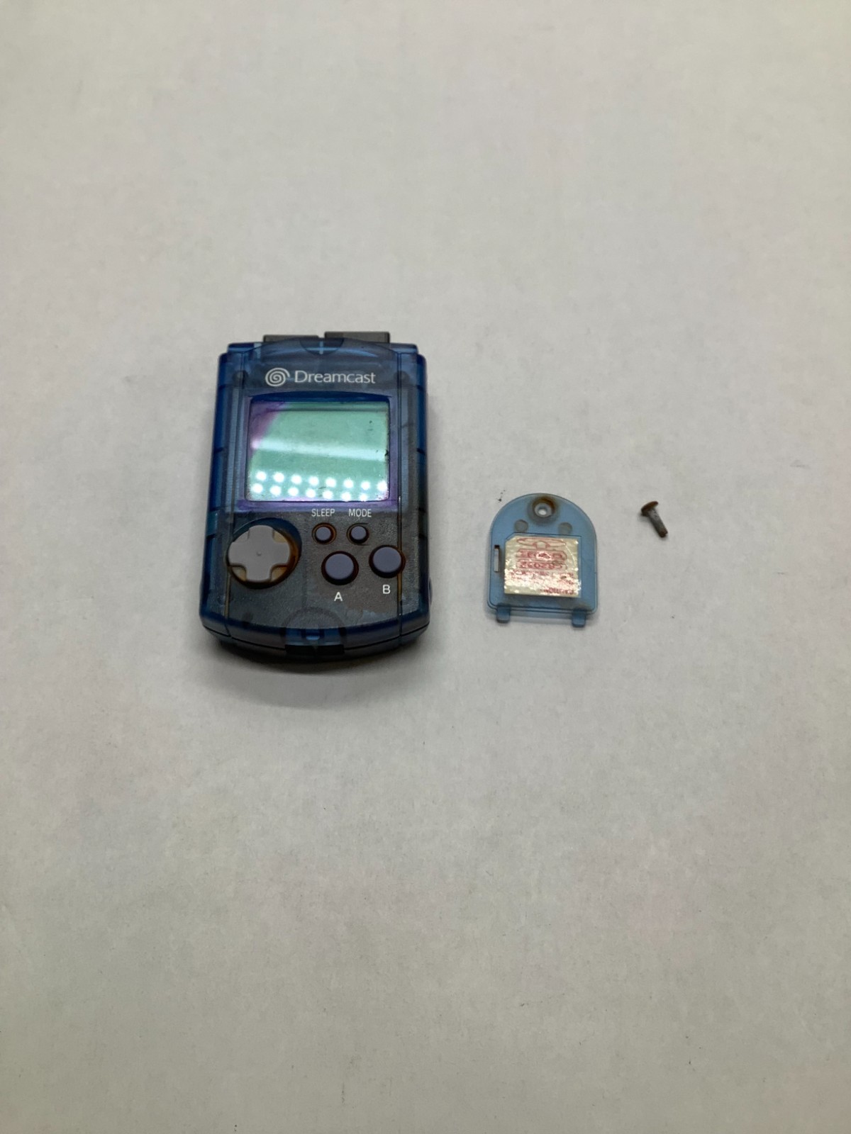 Dreamcast VMU Blue Tested working Batteries Not Included Stained water Damaged