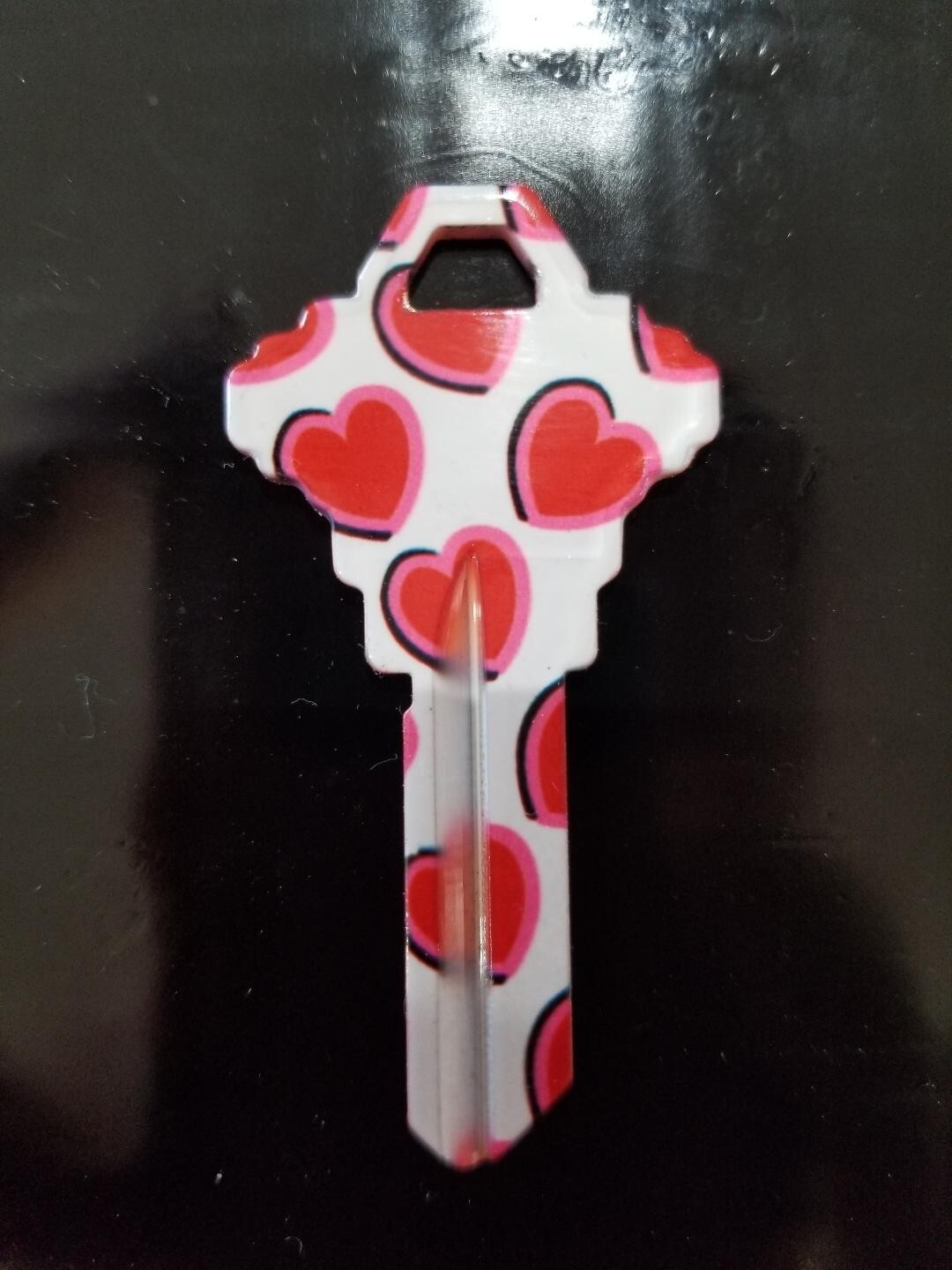 RED HEARTS PRINTED SCHLAGE SC1 KEYBLANK (DISCONTINUED)
