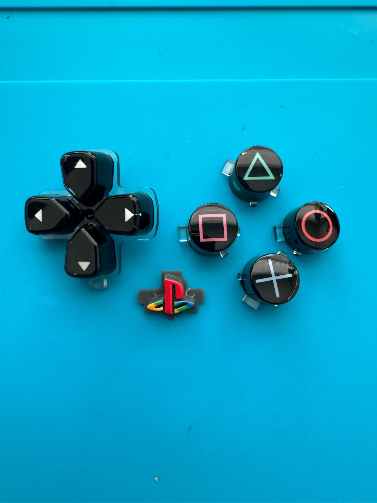 30th Anniversary PS5 6 Piece Retro And Glass Button Set. PS5 Controller