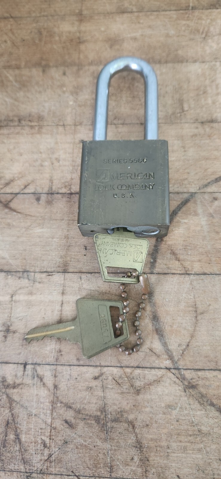 AMERICAN LOCK SERIES 5560 BRASS BODY, HARDENED STEEL SHACKLE, (2) BRASS KEYS.