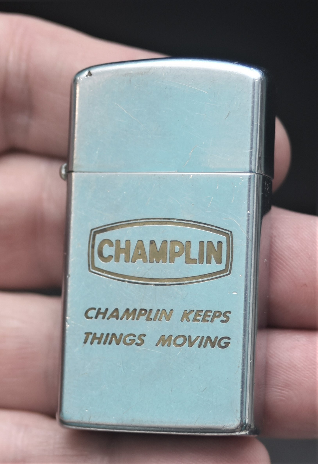 VINTAGE CHAMPLIN KEEPS THINGS MOVING ZIPPO SLIM FLAT BOTTOM IIII  IIII