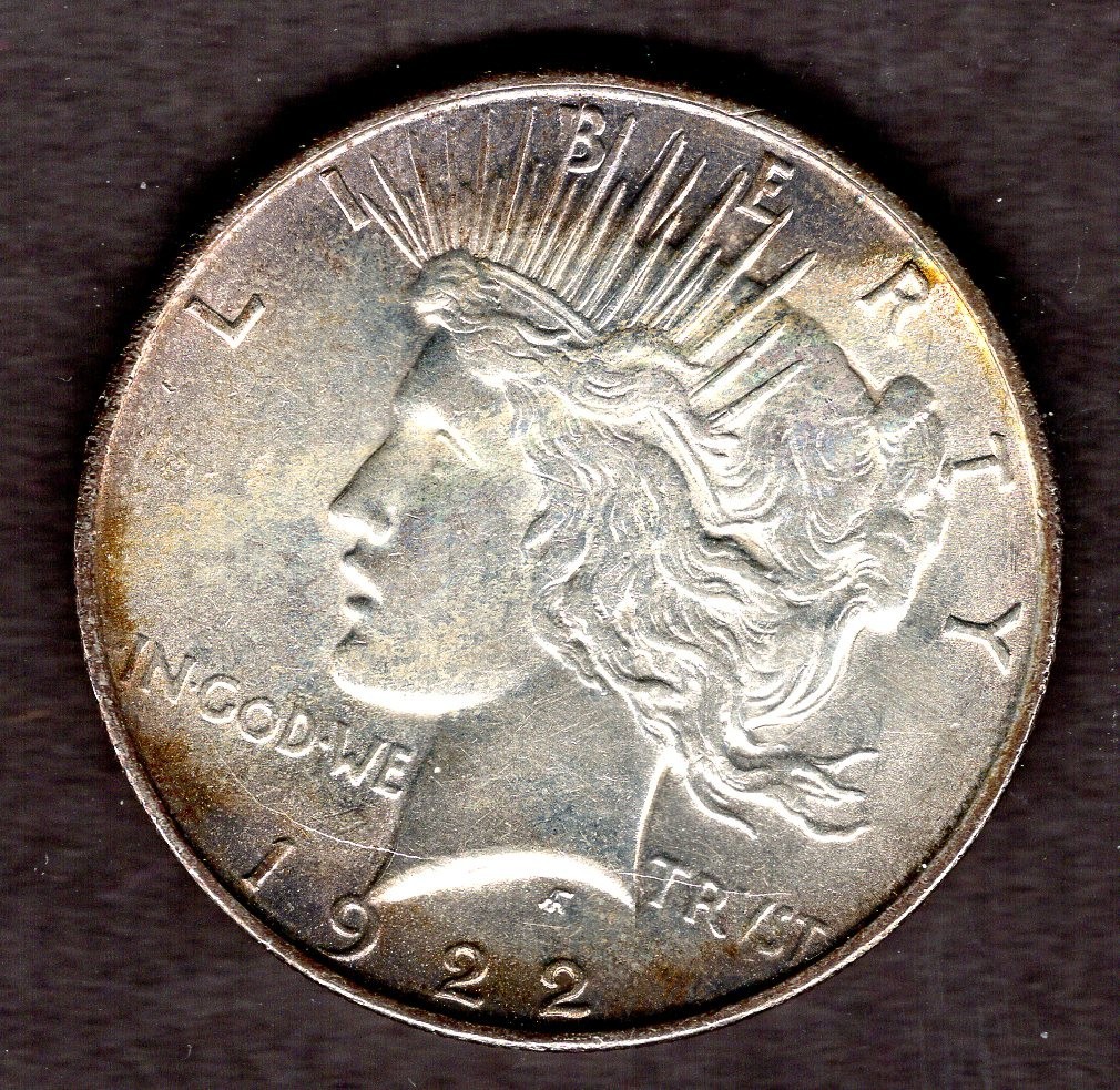 1922-D PEACE SILVER DOLLAR.  UNCIRCULATED WITH ORIGINAL TONING.  YOU GRADE IT.