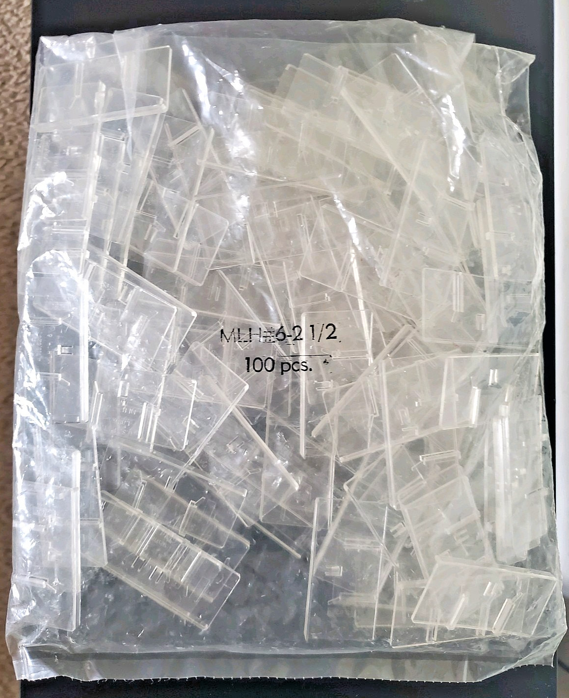 100 Piece Trion Clear Plastic Pressure Sensitive Label Holder for Slatwall Hook
