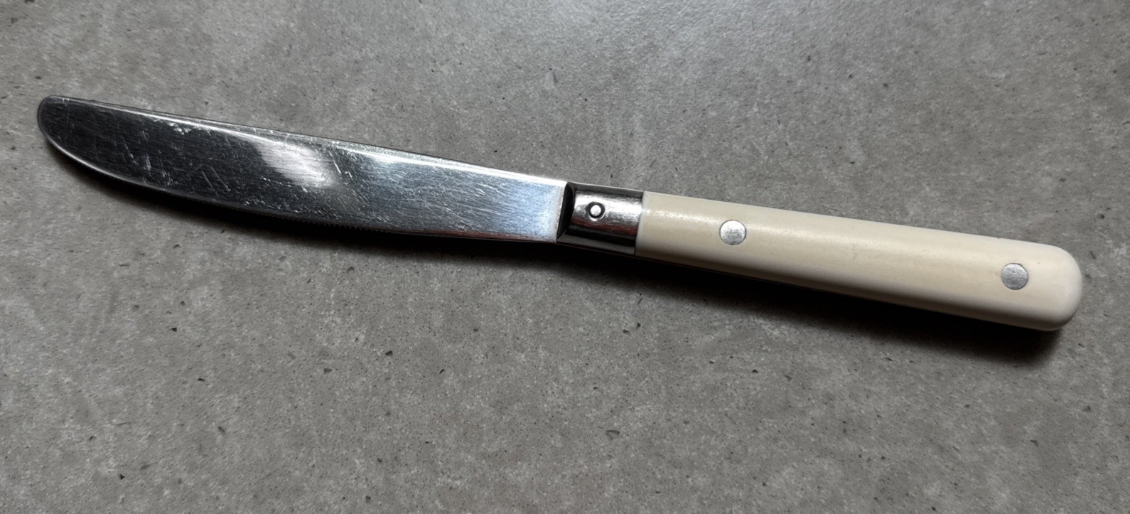 Carnival Stainless Made in Korea White Plastic Handle 3 Rivets 1 Dinner Knife 8"