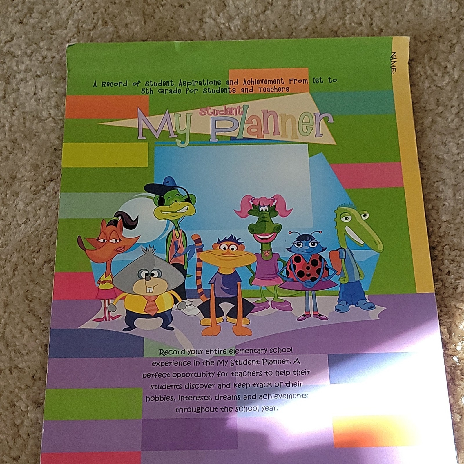 Five AES PHEAA Quarterly Assignment books, One My Student Planner Elementary