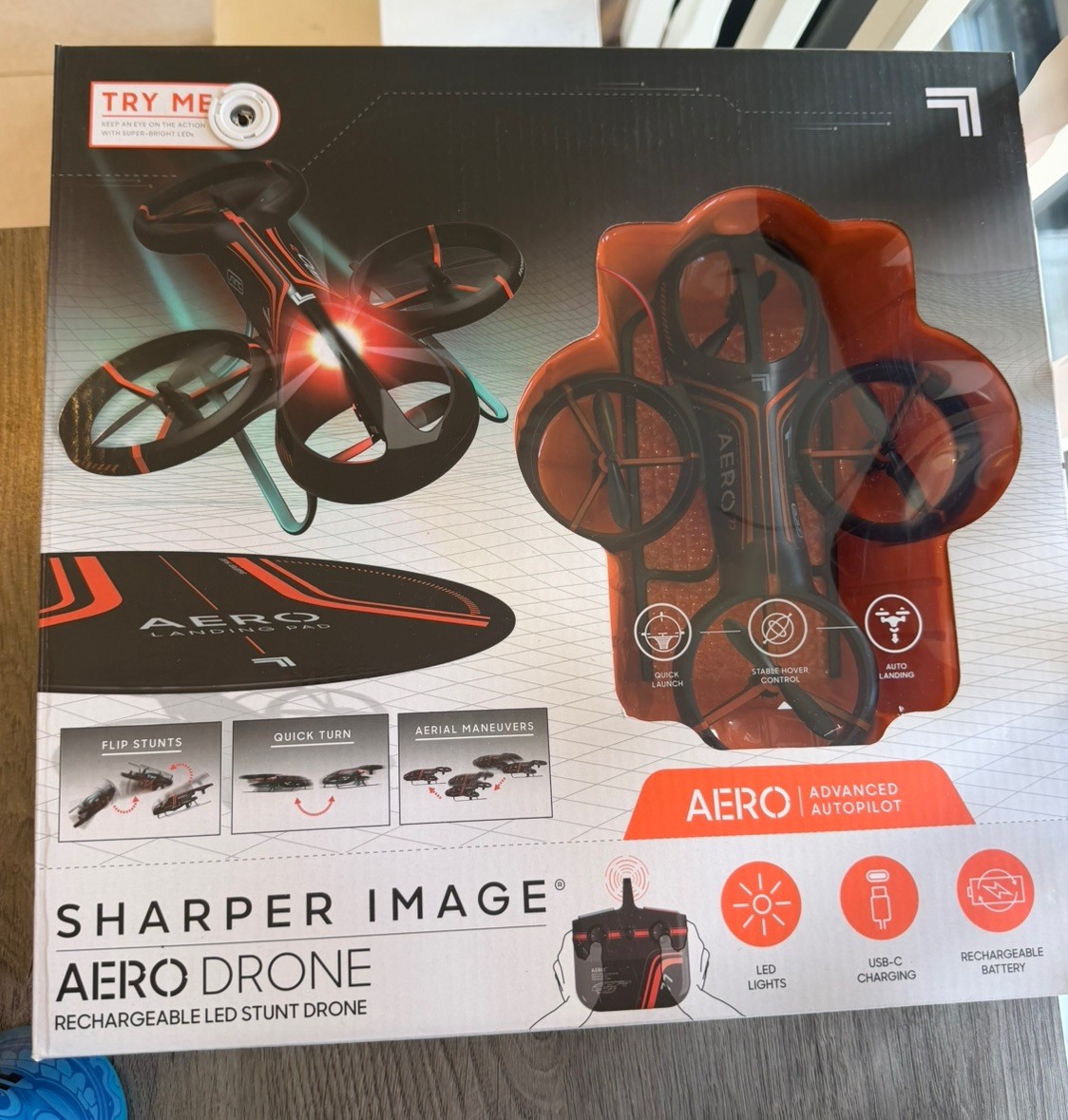 New In Box Sharper Image Aero Stunt Drone 150ft Range Auto Landing LED Lights