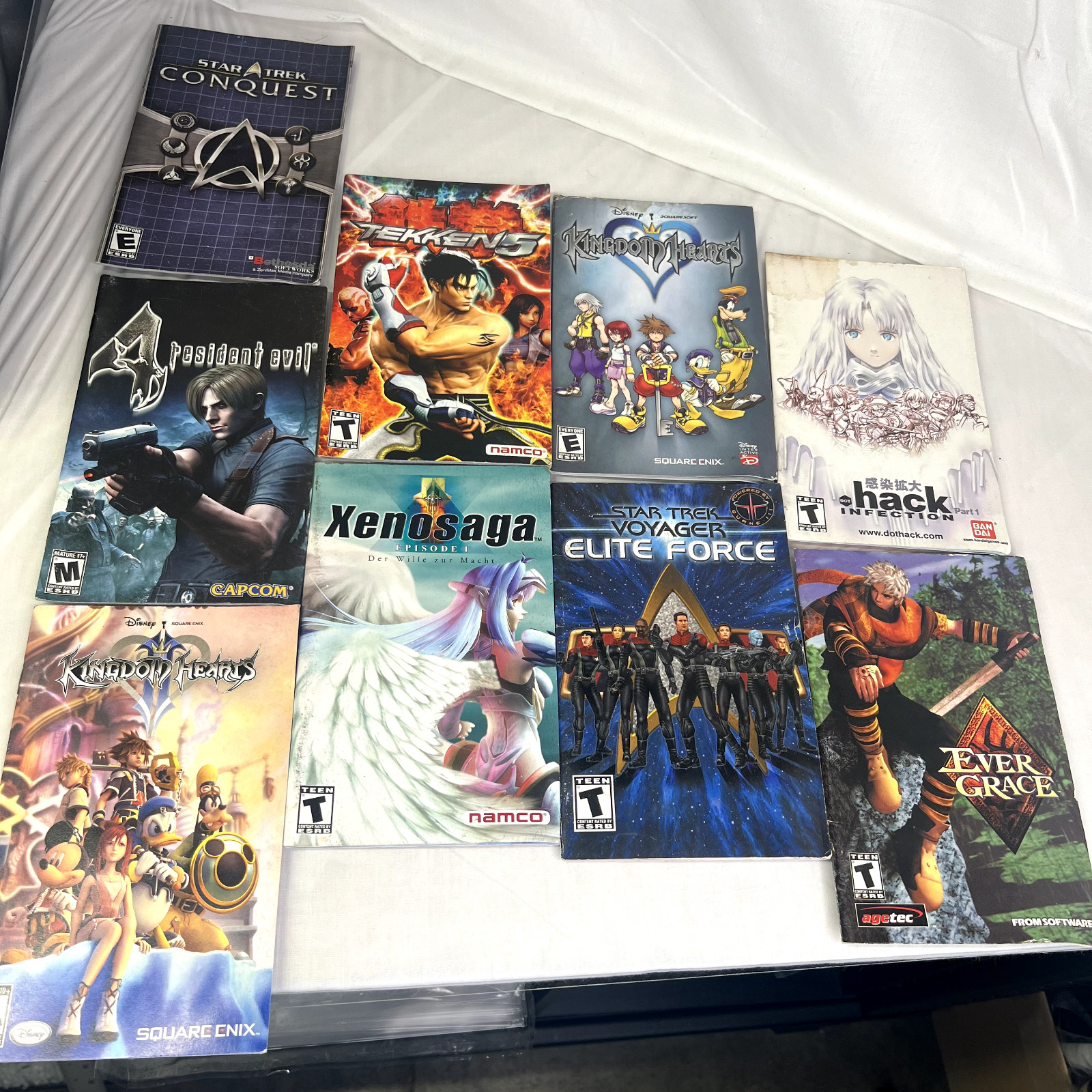 Lot of 9 Booklets from Games Kingdom Heart, Tekken, Star Trek, Xenosaga, EverGra