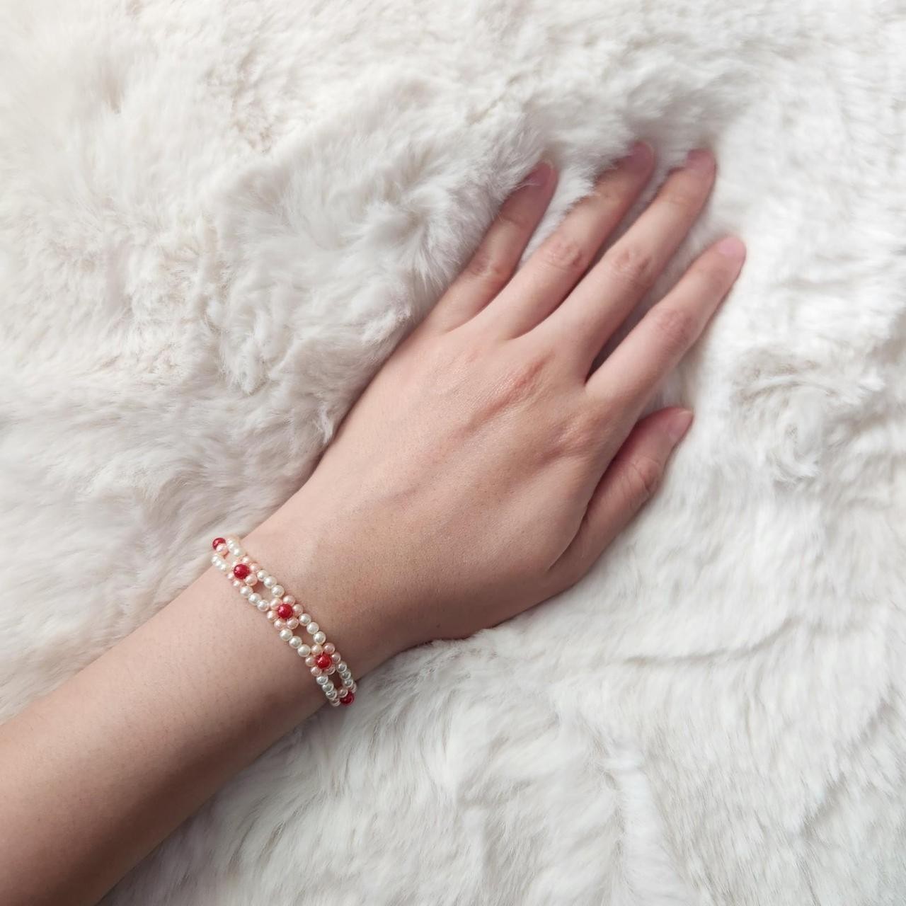 Handmade red pink and cream off white beaded bracelet