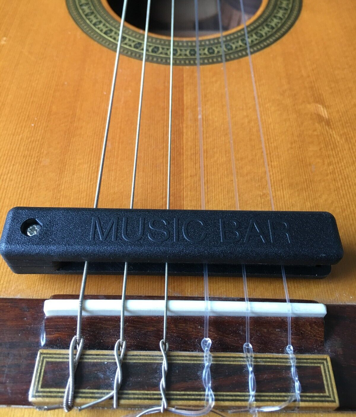 Guitar mute string dampener for quiet practice on acoustic/classical guitars