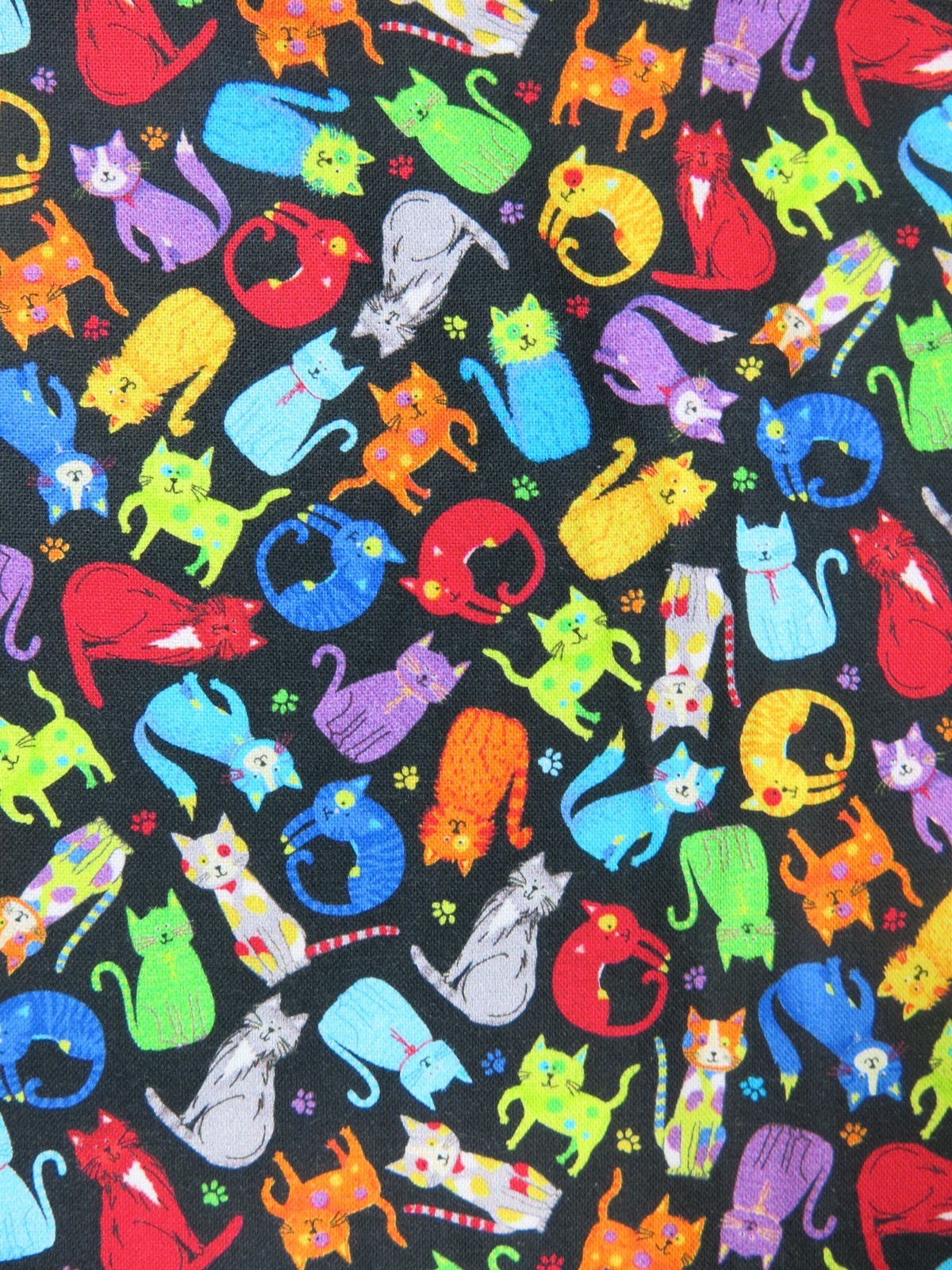 Timeless Treasures Tiny Colorful Cats/Paw Prints on Black Background 100% Cotton
