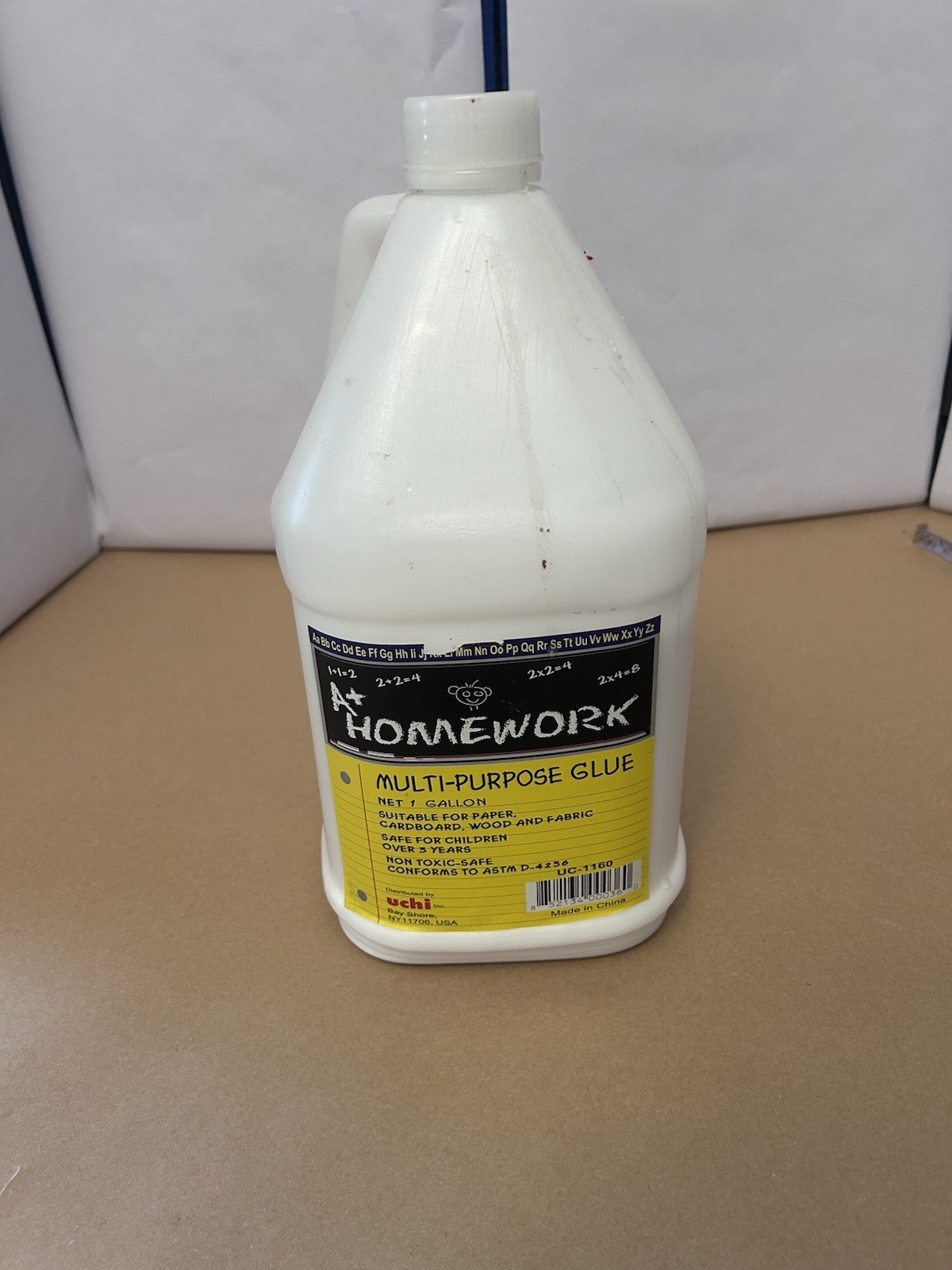 At Homework Multi-Purpose Glue 1 Gallon open and 1/3 used. by Uchi Made in China