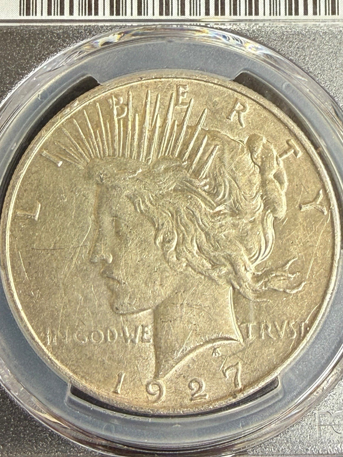 1927-D Peace Dollar PCGS Genuine Stained AU Details