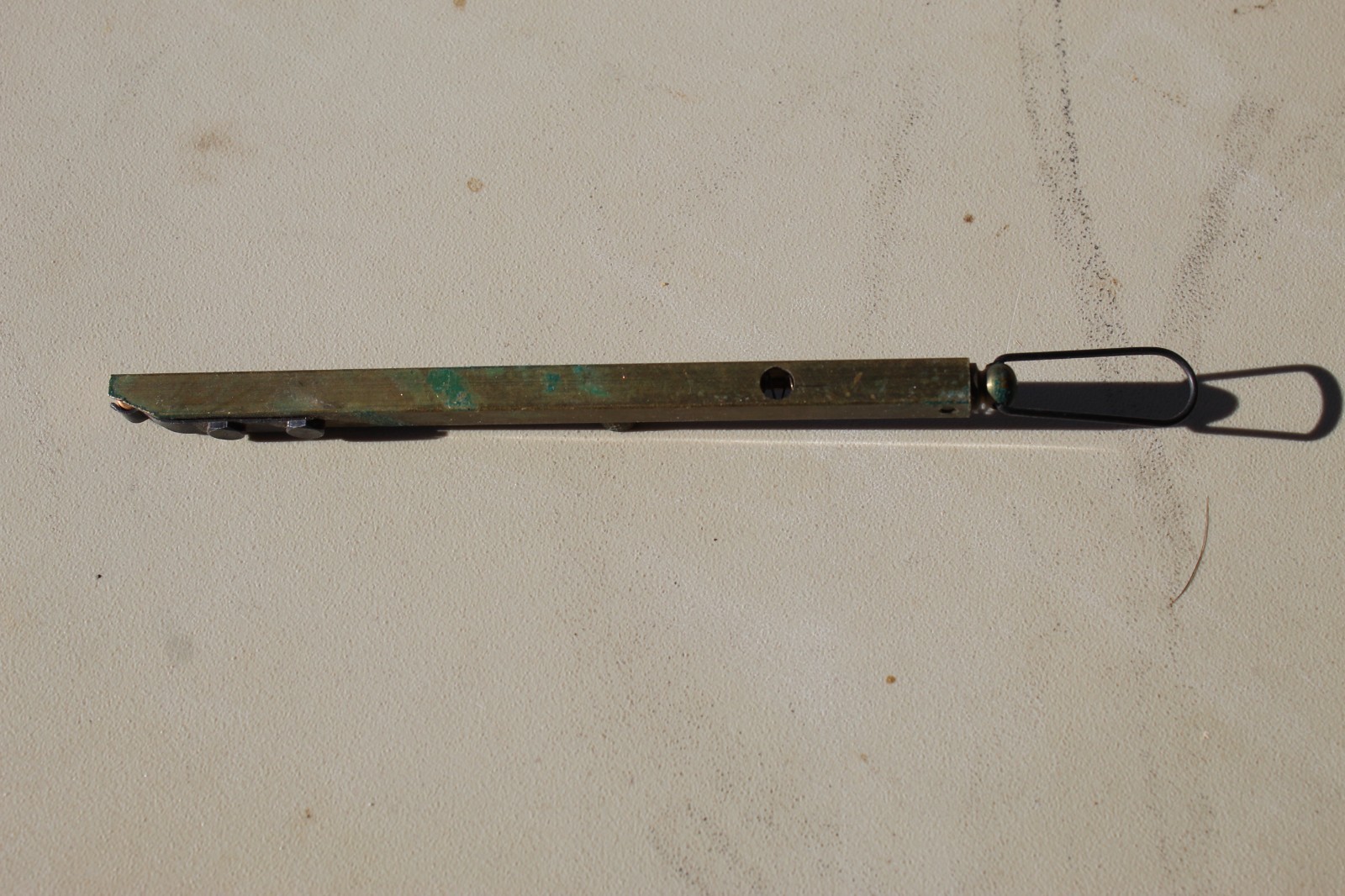 Brass straight-line percussion capper