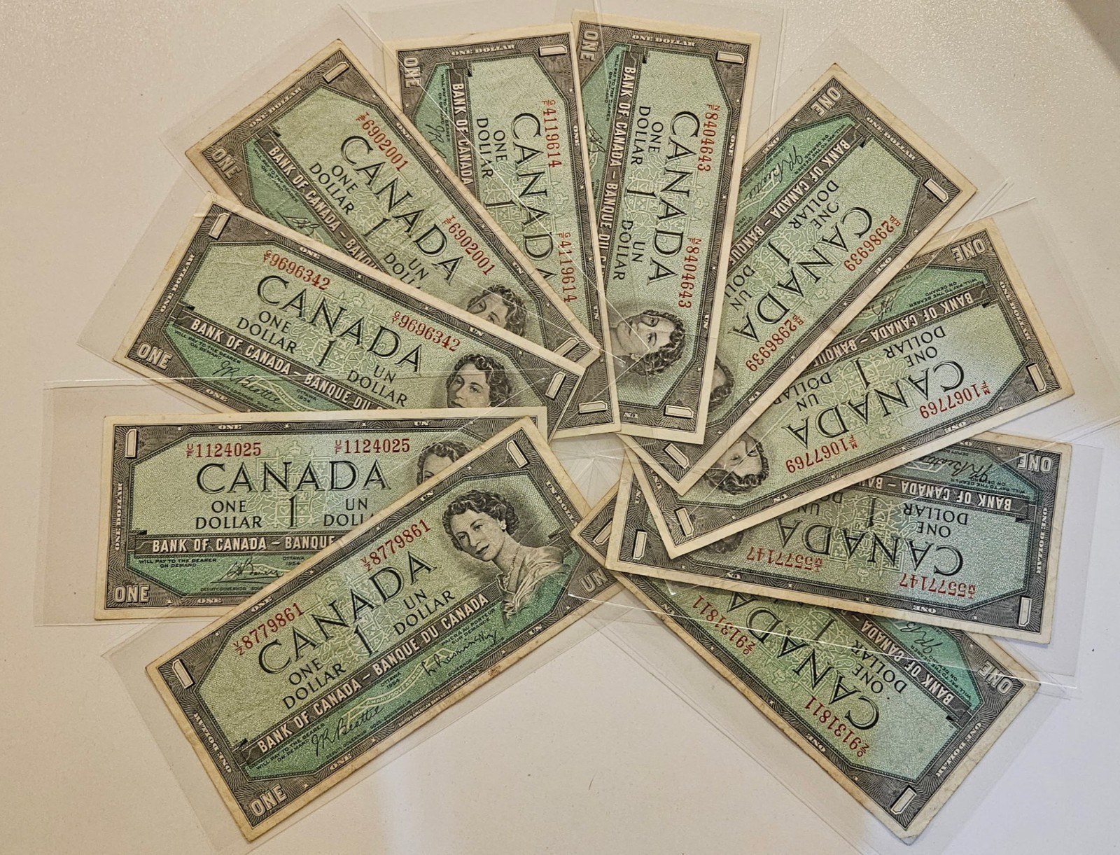 Lot of 10 1954 Bank of Canada $1 featuring Queen Elizabeth  Beattie. Rasminsky.