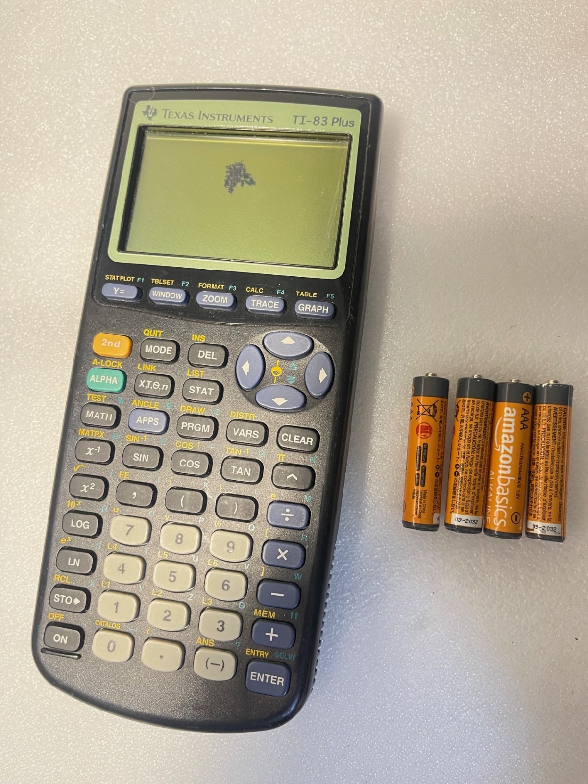 Texas Instruments TI-83 Plus Graphing Calculator w/batteries. damaged screen(U7