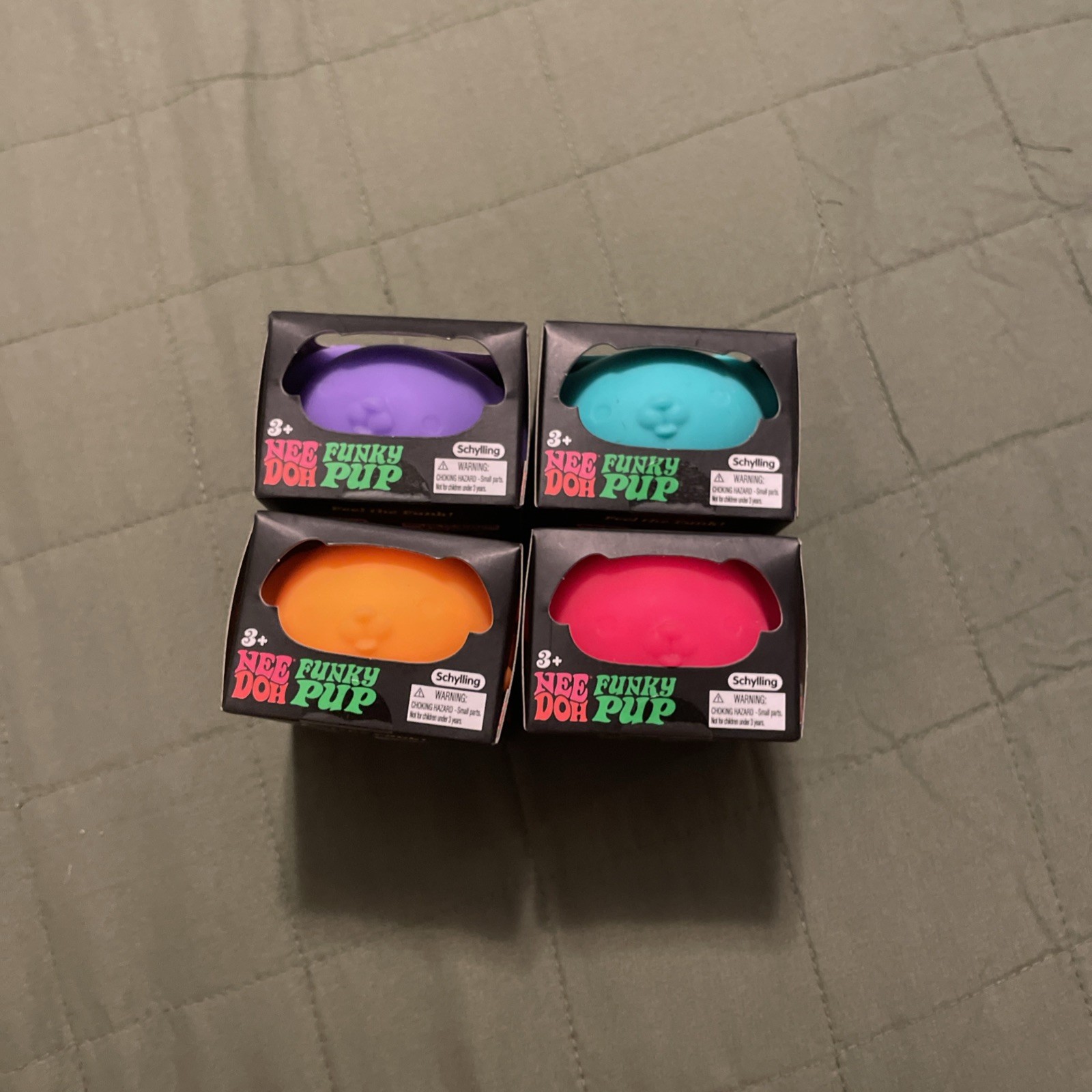 New Doh Funky Pups (4). Purple, Orange, Green, And Pink