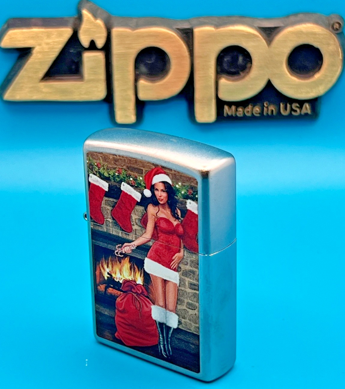Genuine Brand New 2017 ZIPPO Lighter PULLING A CRACKER BY THE FIRE Satin Chrome