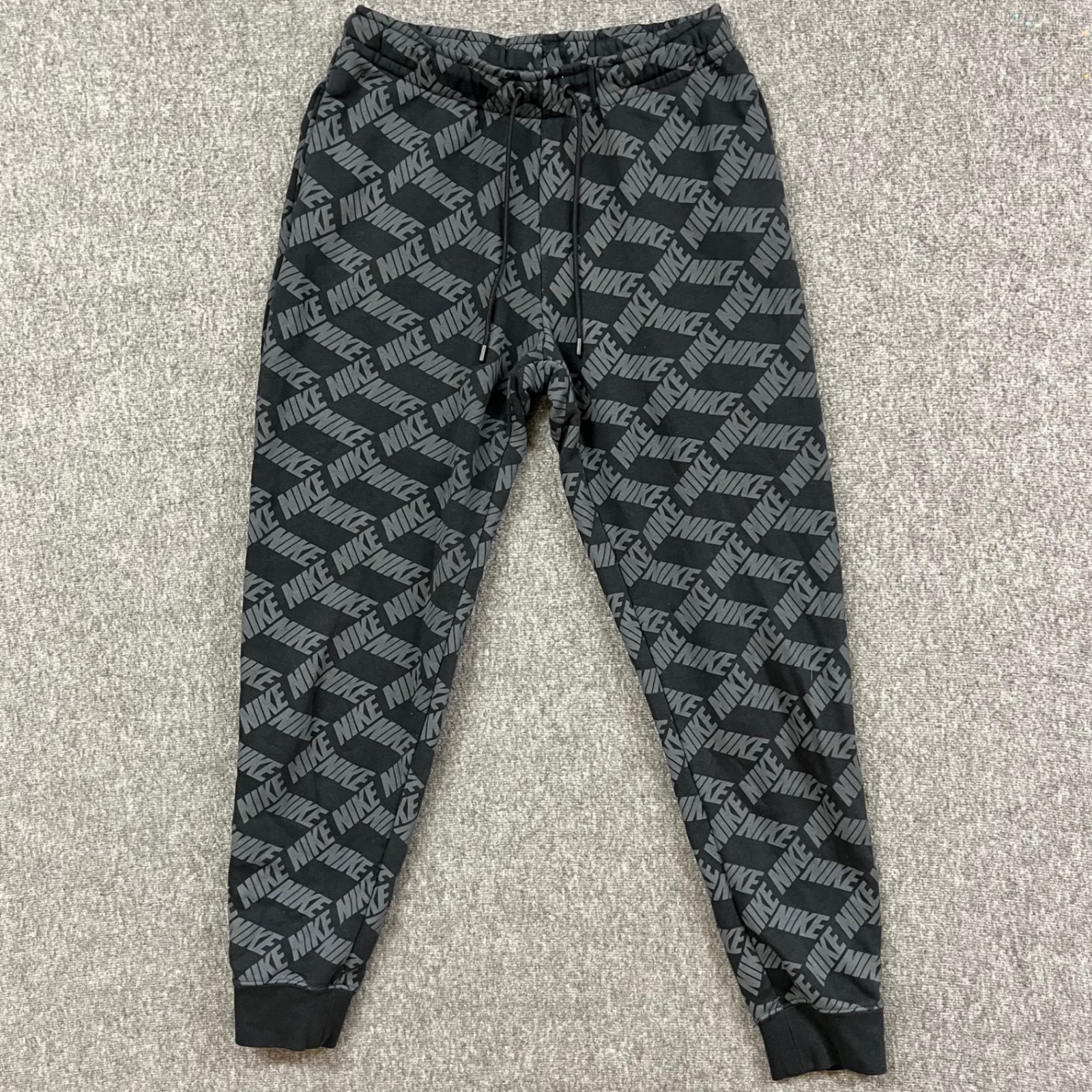 Nike Joggers Mens S Allover Logo Black Gray Drawstring Sweatpants Cuffed Fleece