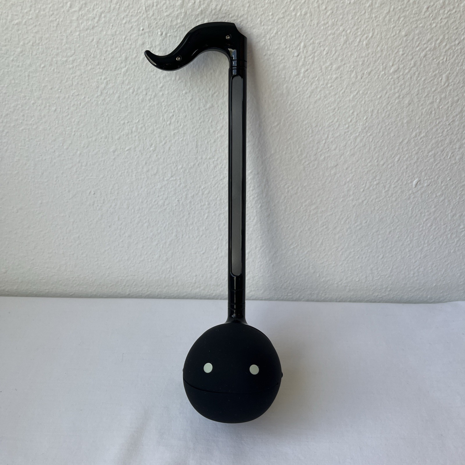 Otamatone from Maywa Denki Black synth instrument musical note