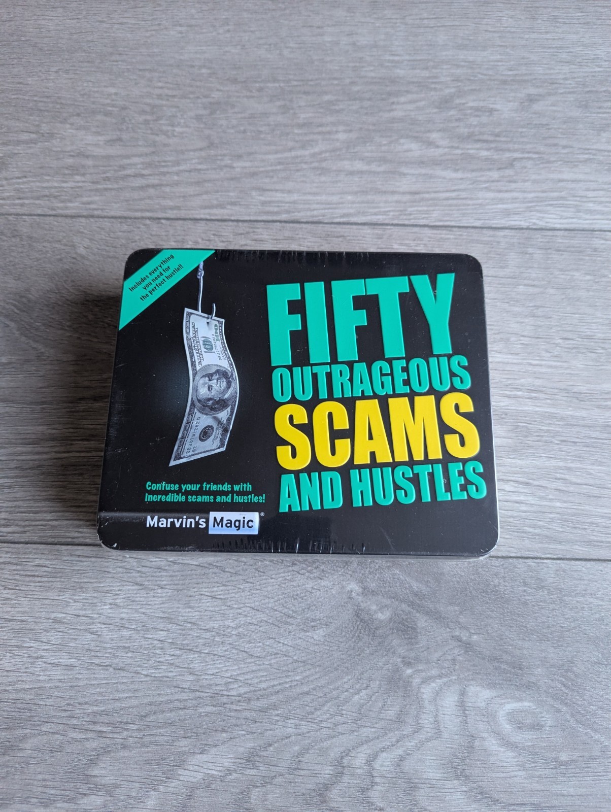Marvin's Magic Fifty Outrageous Scams and Hustles Magic Trick Set Gift Tin  Kit
