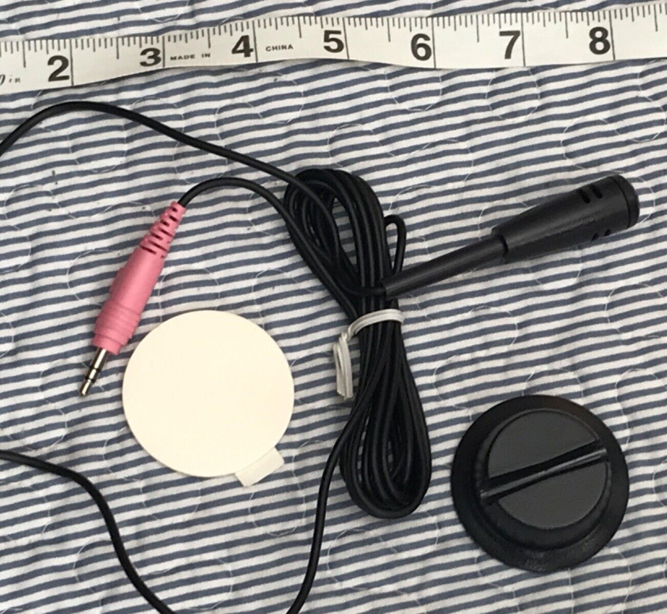 Mini microphone attachable to wall or desk