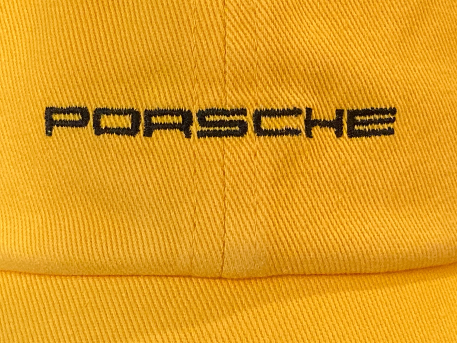 2026 PORSCHE DESIGN FANWEAR 100% COTTON YELLOW HAT W/EMBROIDERED PORSCHE LOGO.