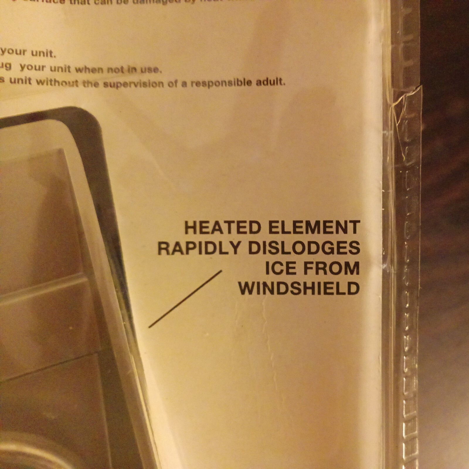 Heated Ice Scraper Rapidly Dislodges Ice Cream Windshield Nip