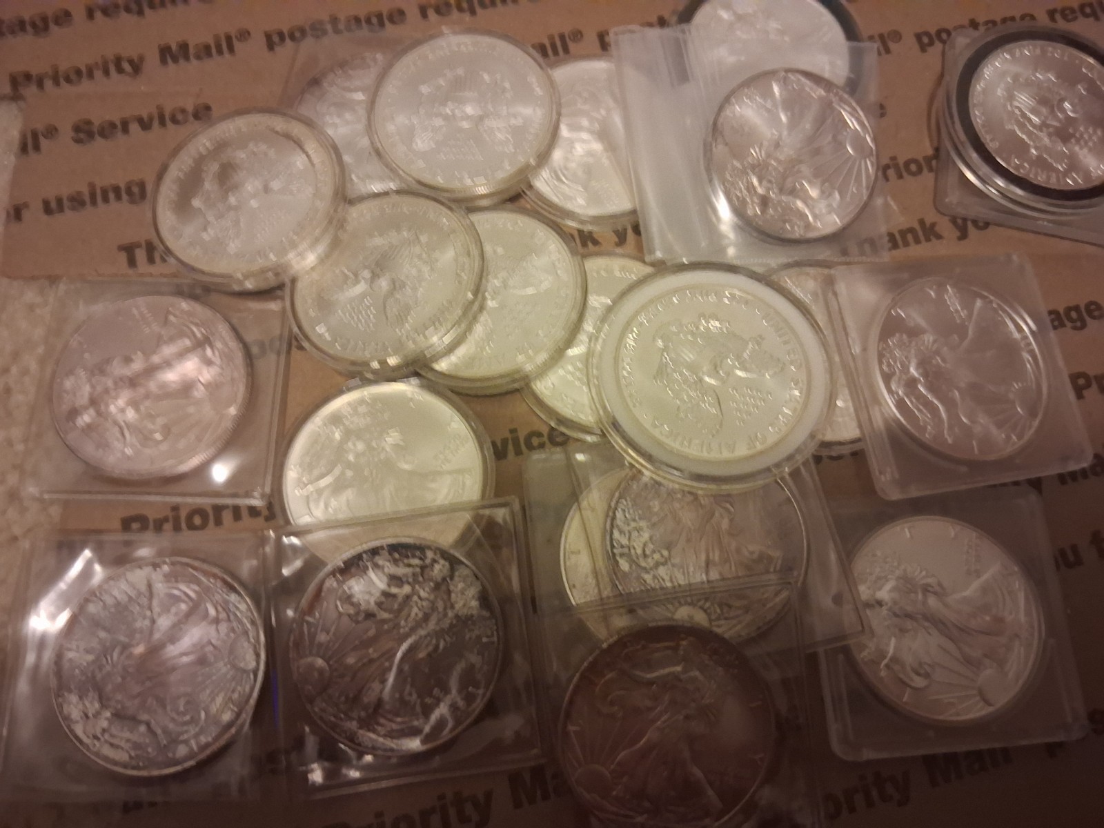 23 US Silver Eagles-- .999 Silver-some toned--see photos