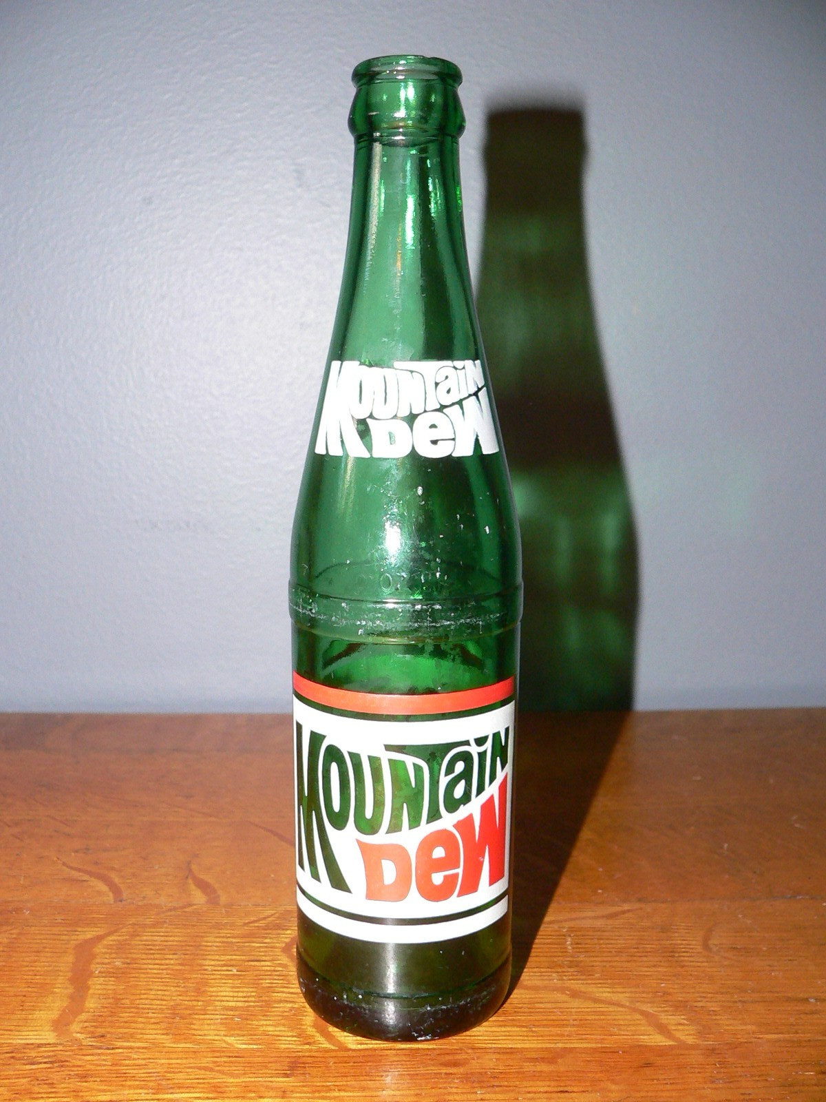 Vintage Mountain Dew Empty 10 oz Bottle with Red & White Classic Logo