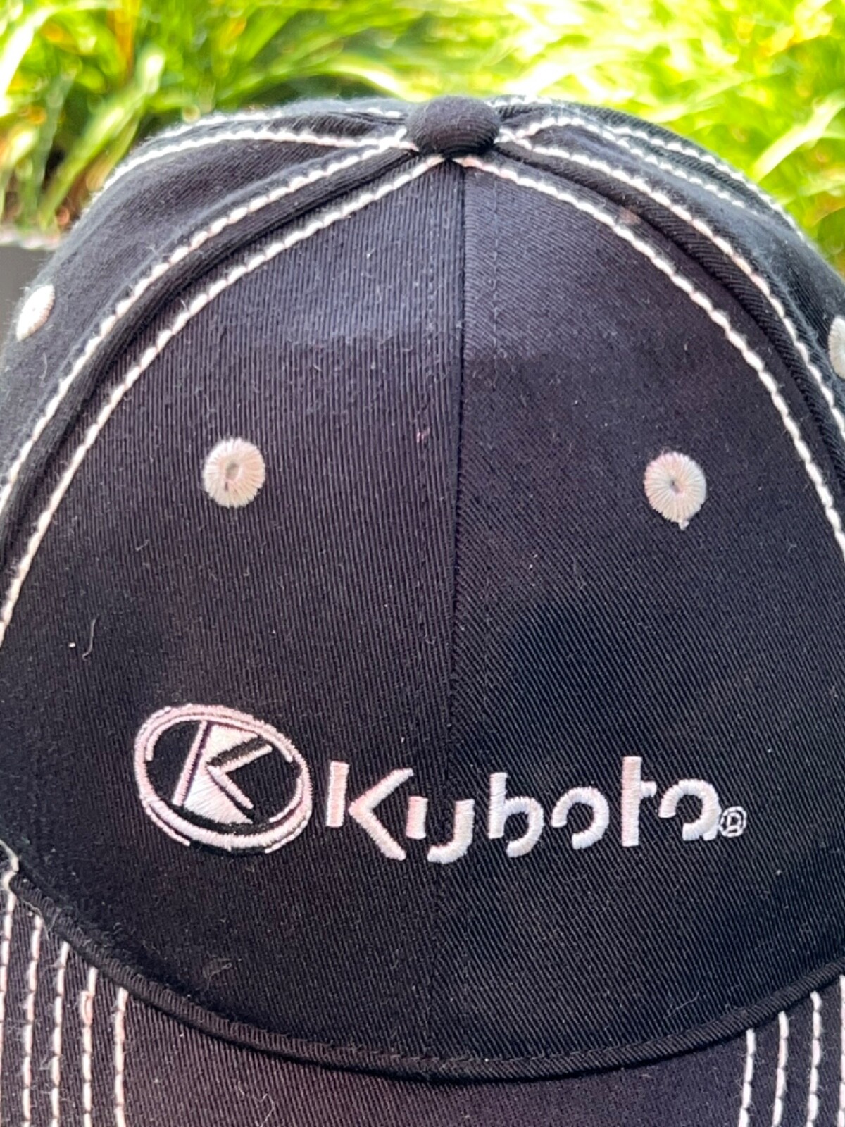 Kubota black with white accents topstitch Hat Cap Hook Loop Orange under bill.