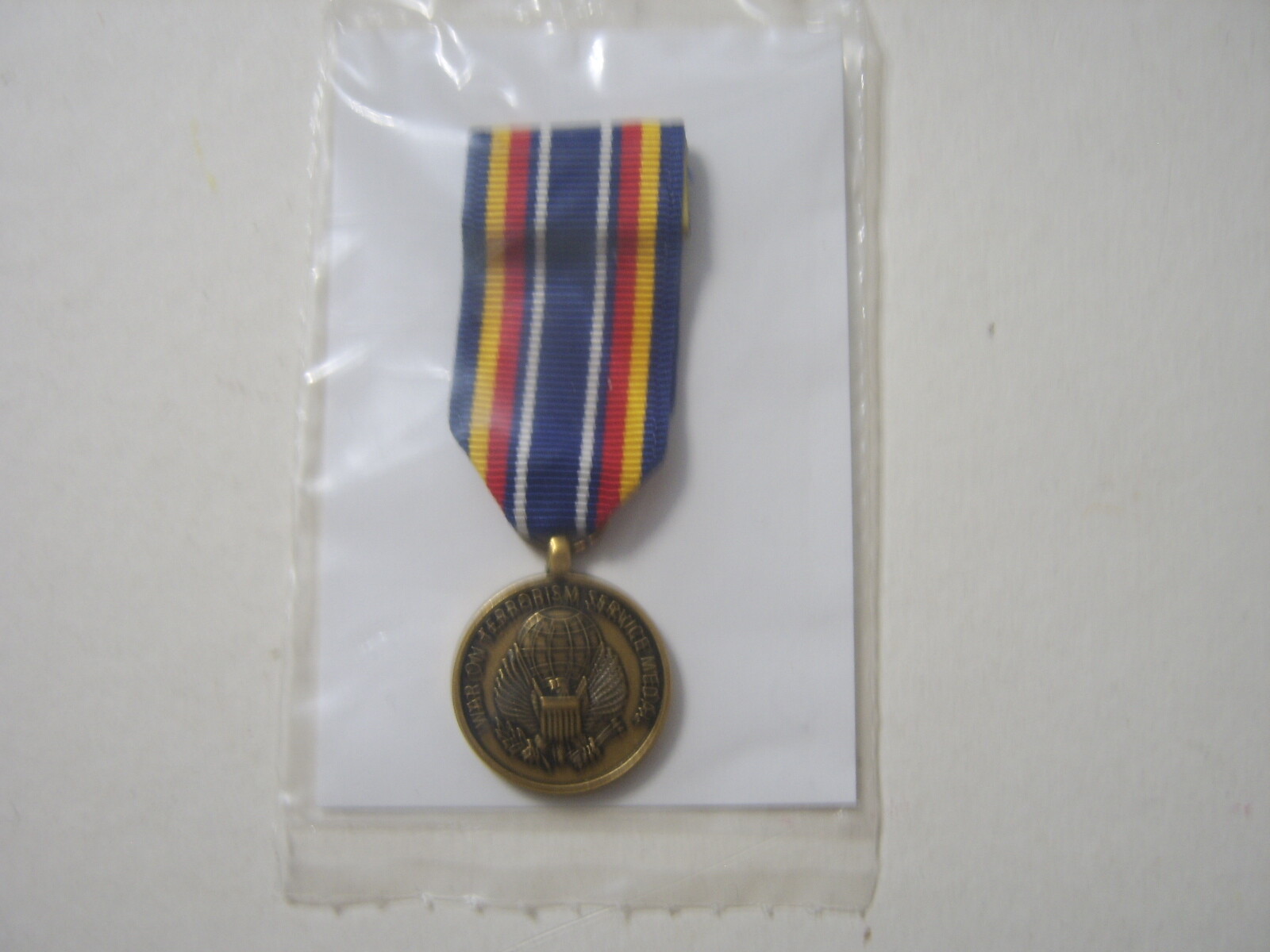 GLOBAL WAR ON TERRORISM MINIATURE NEW IN PACK - SLIDE ON MOUNT