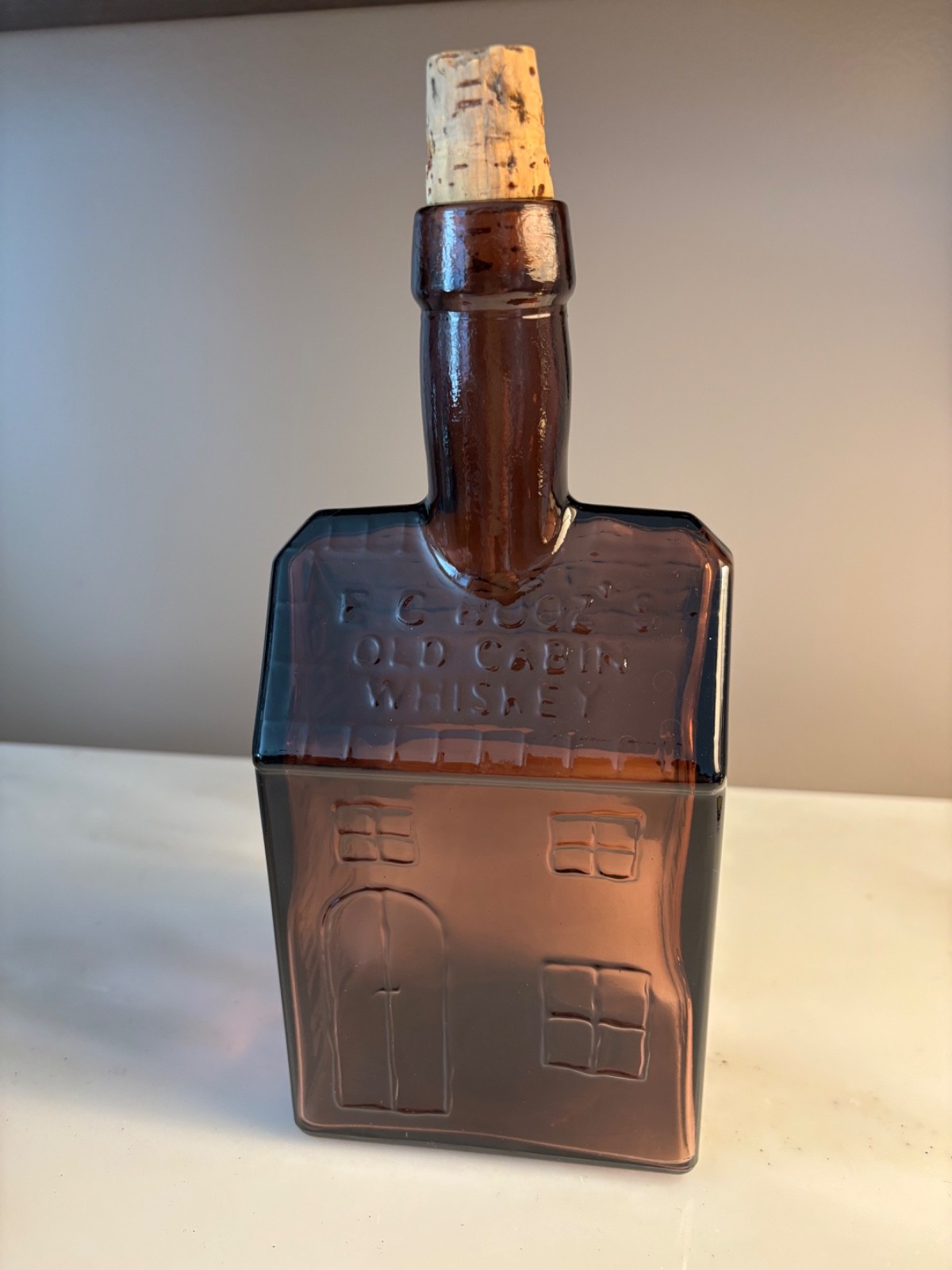 E. C. Booz's Old Cabin Whiskey Bottle (1840), Amethyst Color Glass, Cabin Shape