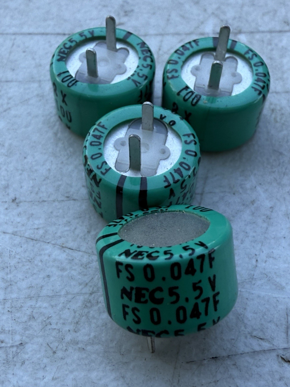 LOT OF  4 FS0H473ZF NEC CAPACITOR 0.047F 5.5V ALUMINUM ELECTROLYTIC RADIAL.