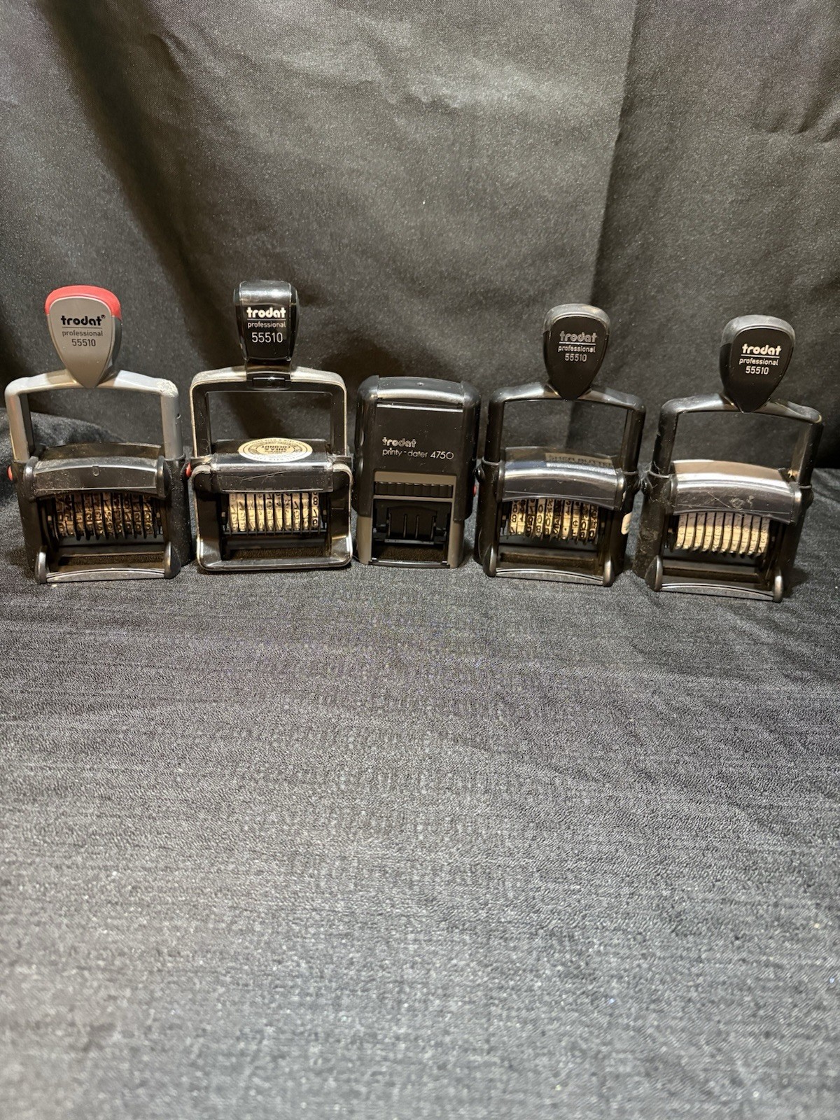 5 self inking trodat stamps (4- 10 band 55510 & 1- 4750) all used.