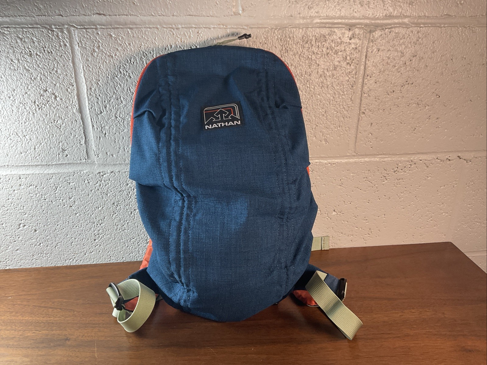 Nathan runway Backpack Small Blue/Orange Gently Used