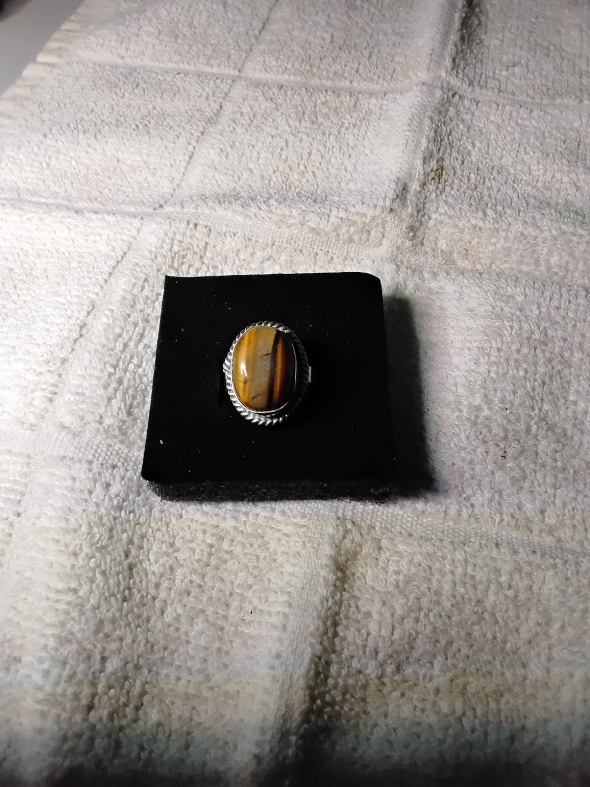Tiger's Eye Oval Ring Bezel Set In Rhodium Plated Setting. Size 7