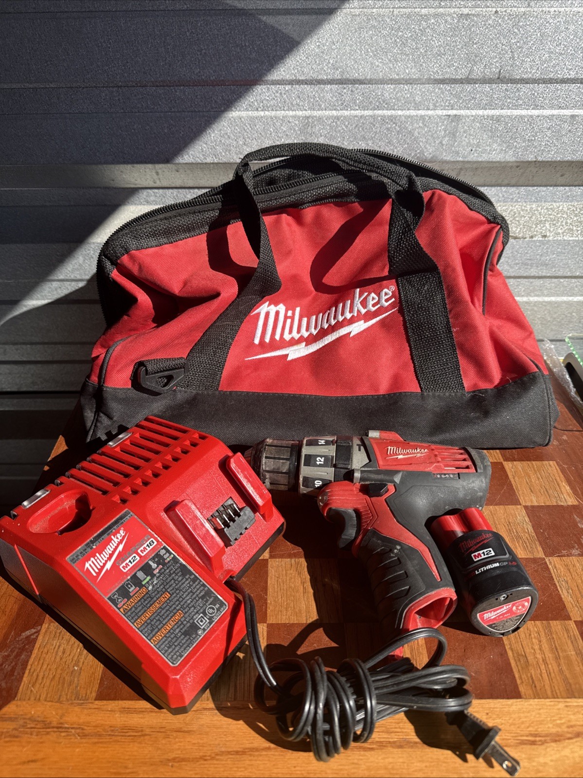 Milwaukee Drill Driver M12 Battery, Charger And Tool Bag Lot Used