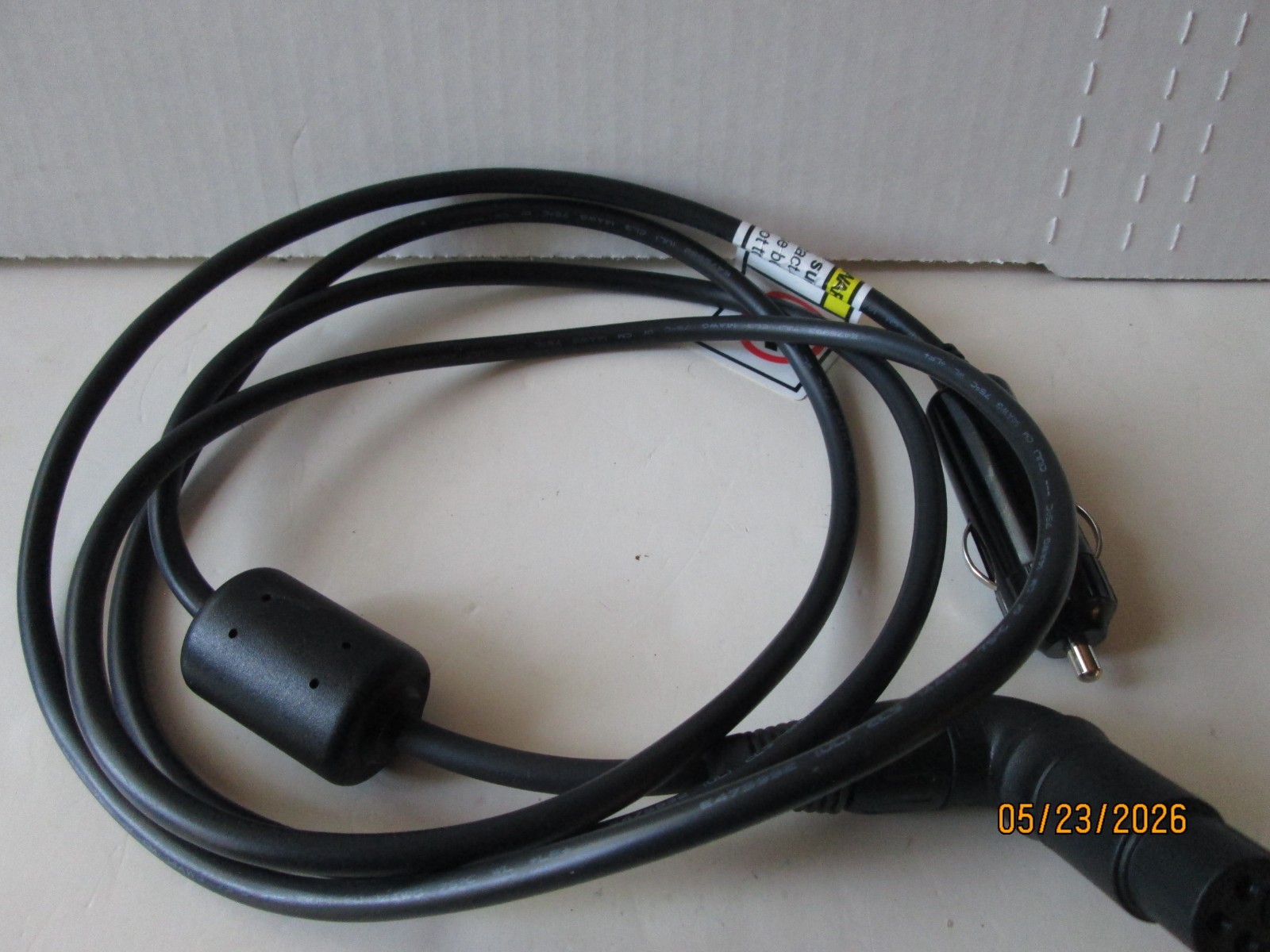 UNKNOWN CORD THAT PLUGS INTO YOUR CIGERETTE LIGHTER.