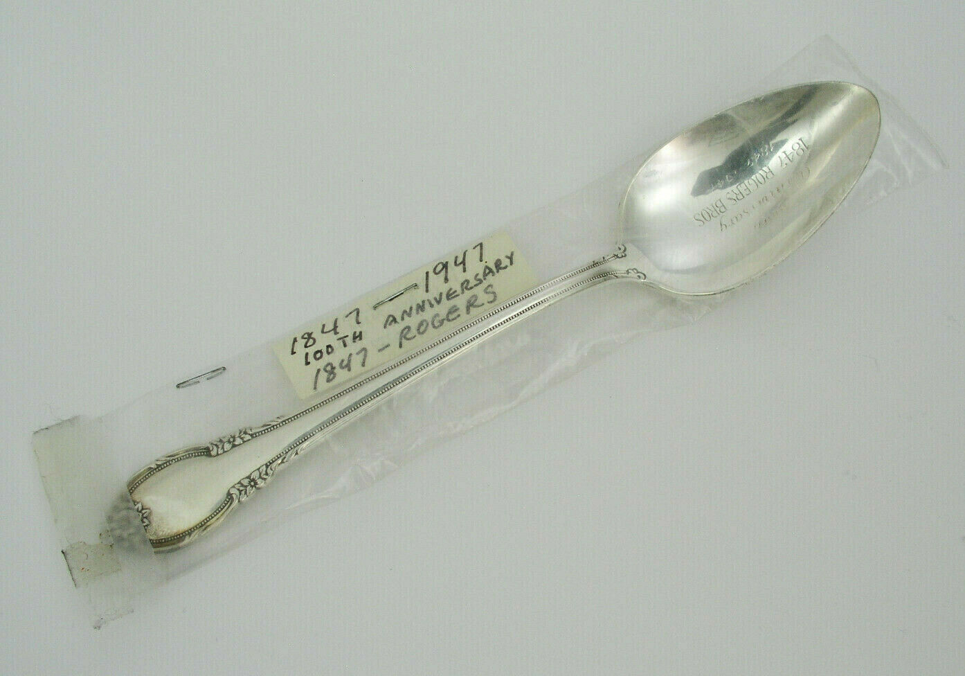 ROGERS 1847-1947 100TH ANNIVERSARY SILVERPLATE TEASPOON - REMEMBRANCE - UNUSED