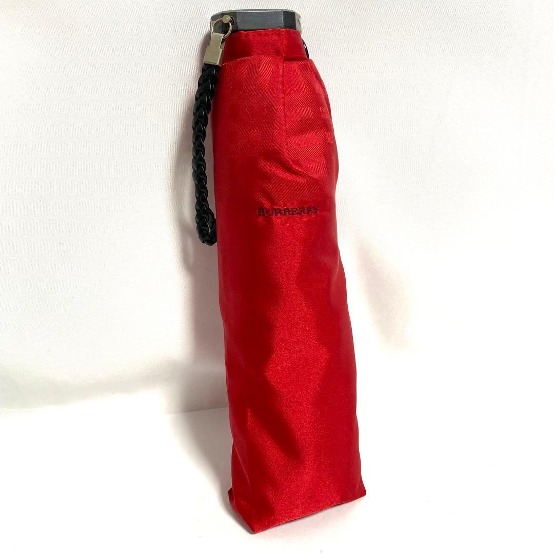 Unused Burberry folding umbrella in red
