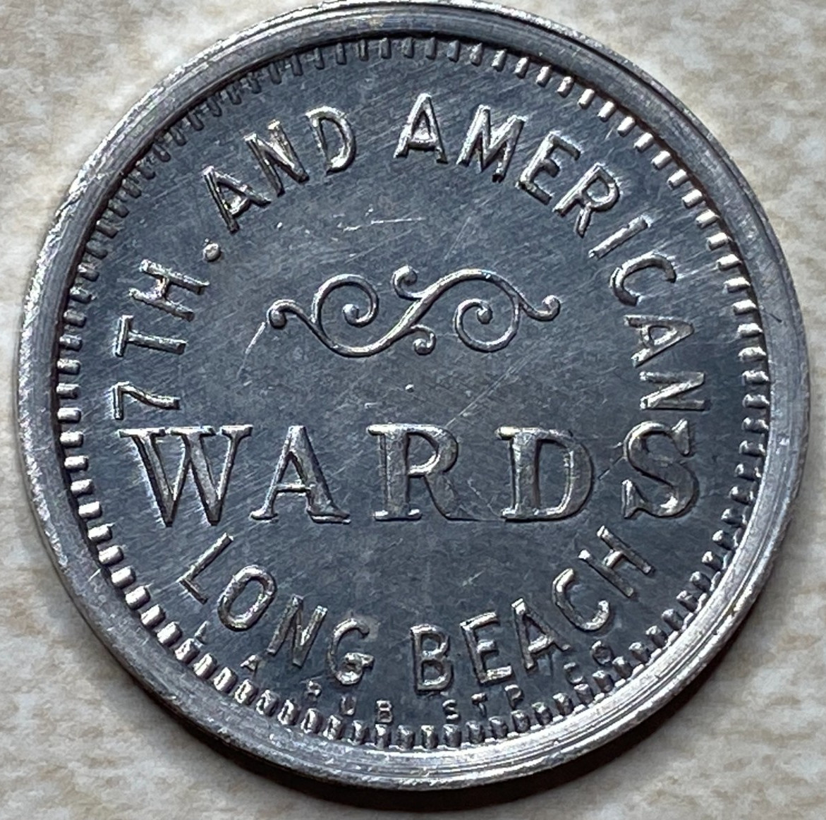 T9037 WARDS 7th and American, Long Beach, CA  Anillo Restrike Arcade Token