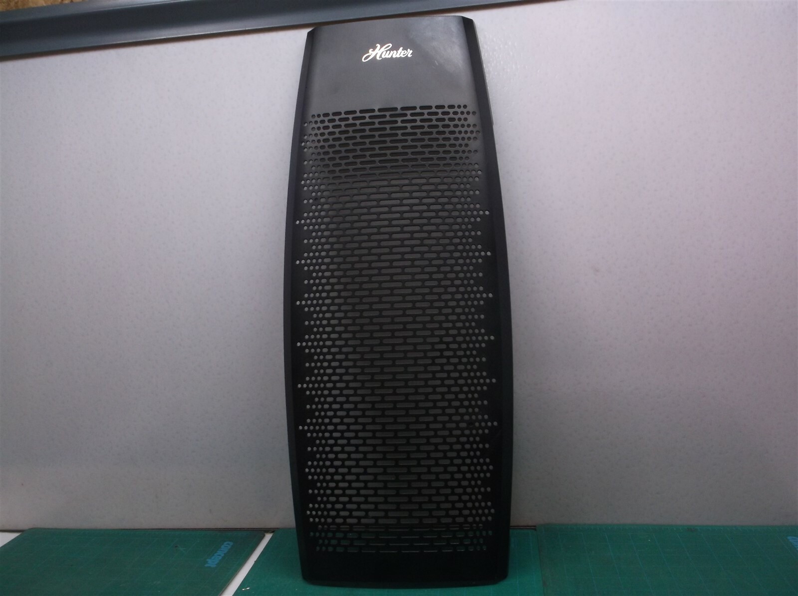 Black front grill off a Hunter Tall Tower Air Purifier hp600
