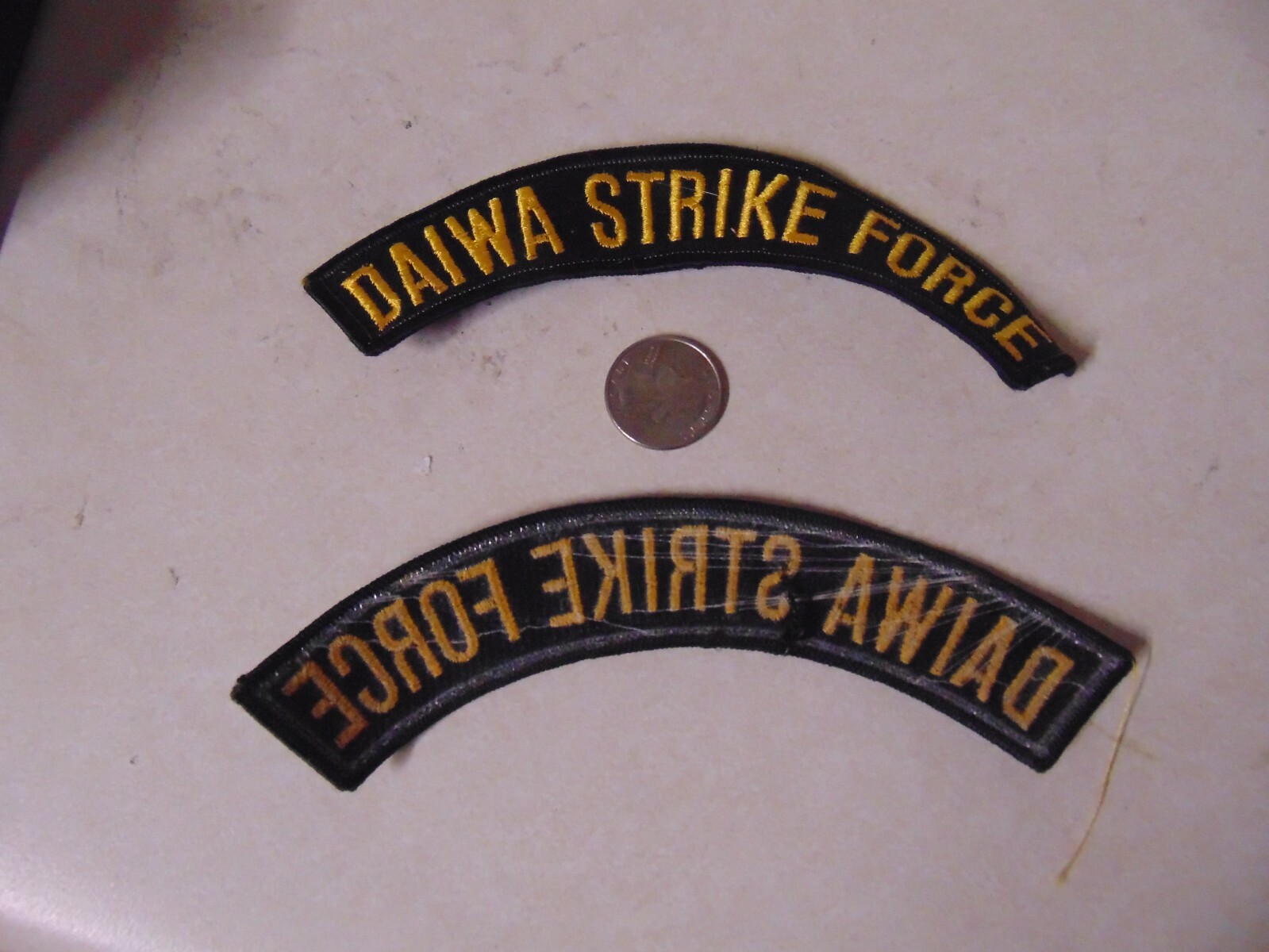 PATCH OLDER SEW ON DAIWA STRIKE BLACK WITH YELLOW LETTERS APPROX 6 INCHES