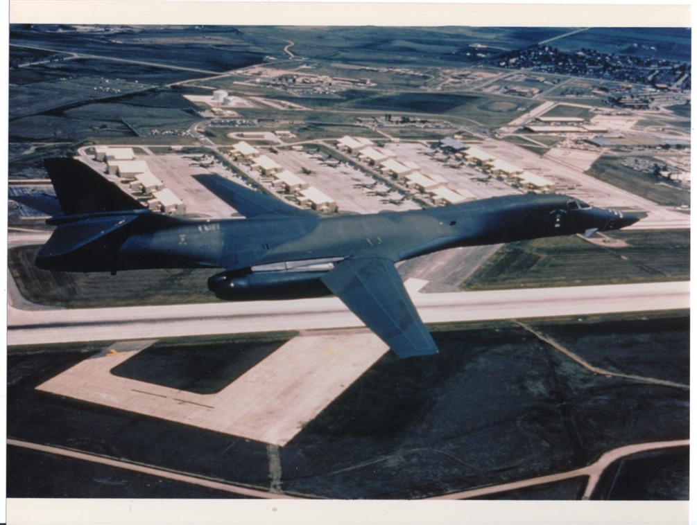 1990-2000s USAF B-1B Lancer Bomber Flying Over Airfield 8.5x11 Original Photo
