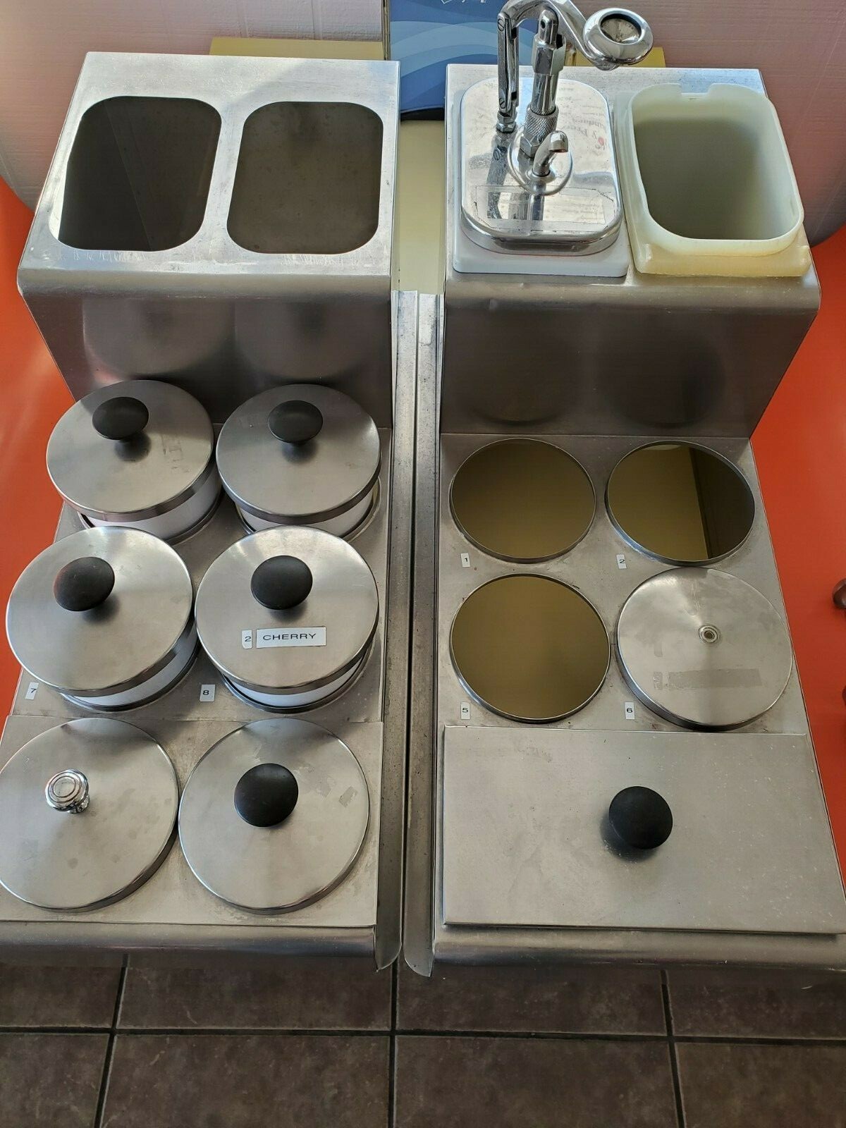 used  ice cream topping dispenser with 6 ladels and 6 lids 1 square bin