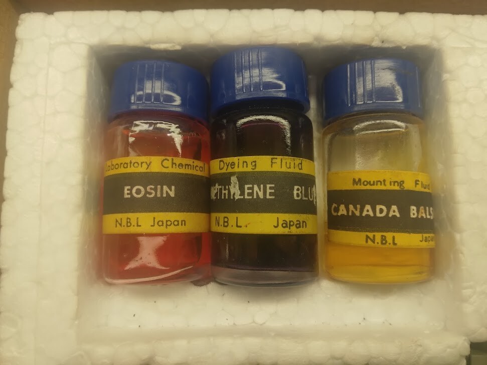 Small microscope kit with tools, slides, and case