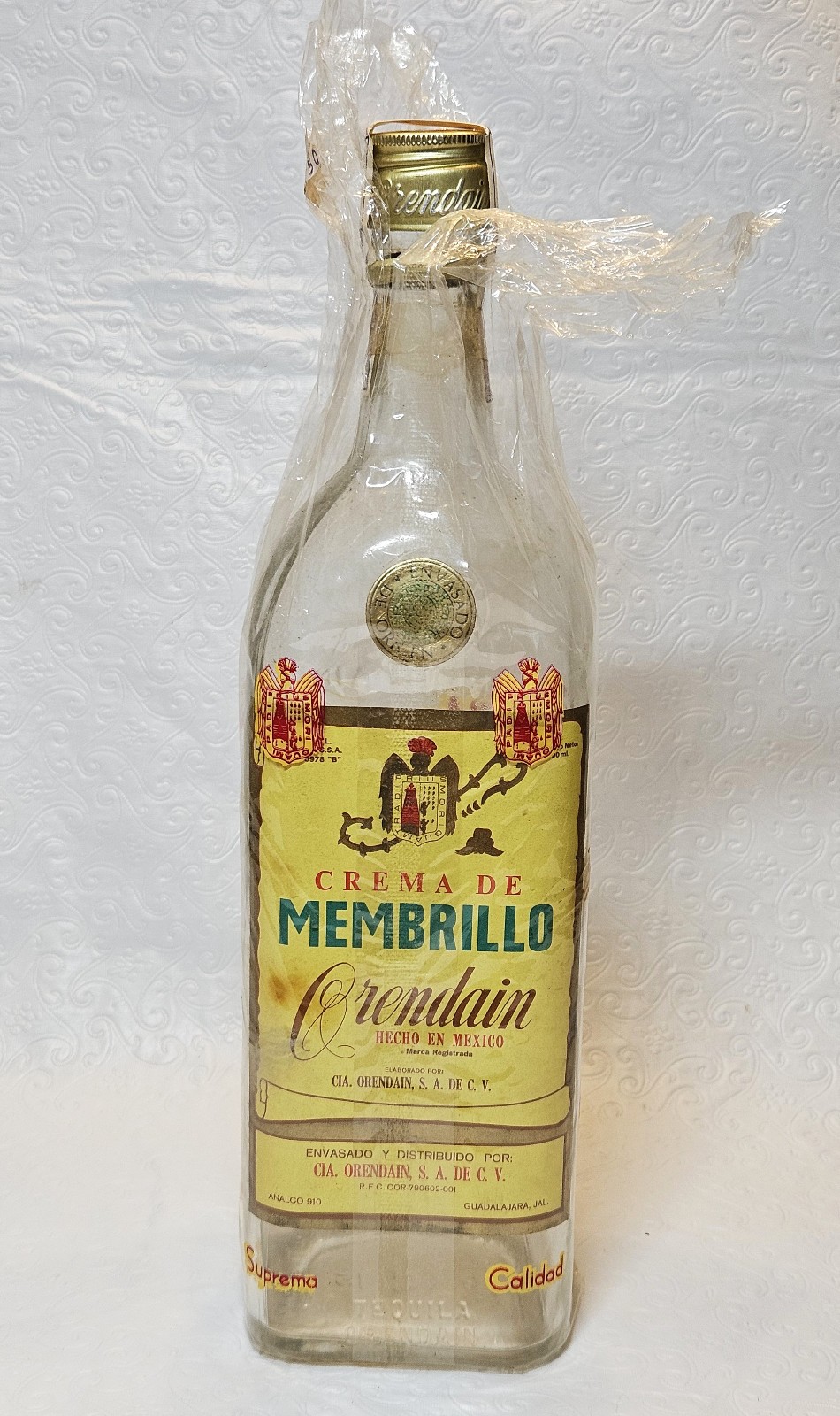 1950's Orendain Crema de Membrillo Liqueur Bottle w/ Cellophane Wrapper - Empty