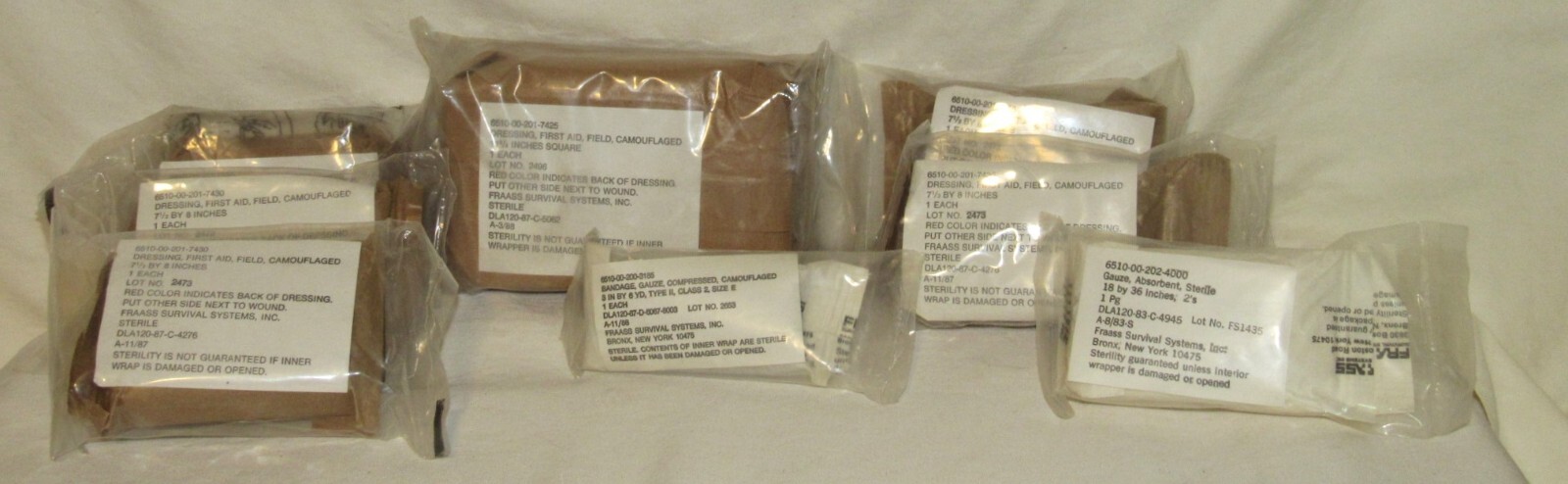 U.S. Army FRAASS Survival First Aid Field Dressings Asst. Lot of 8 (1983-1988)